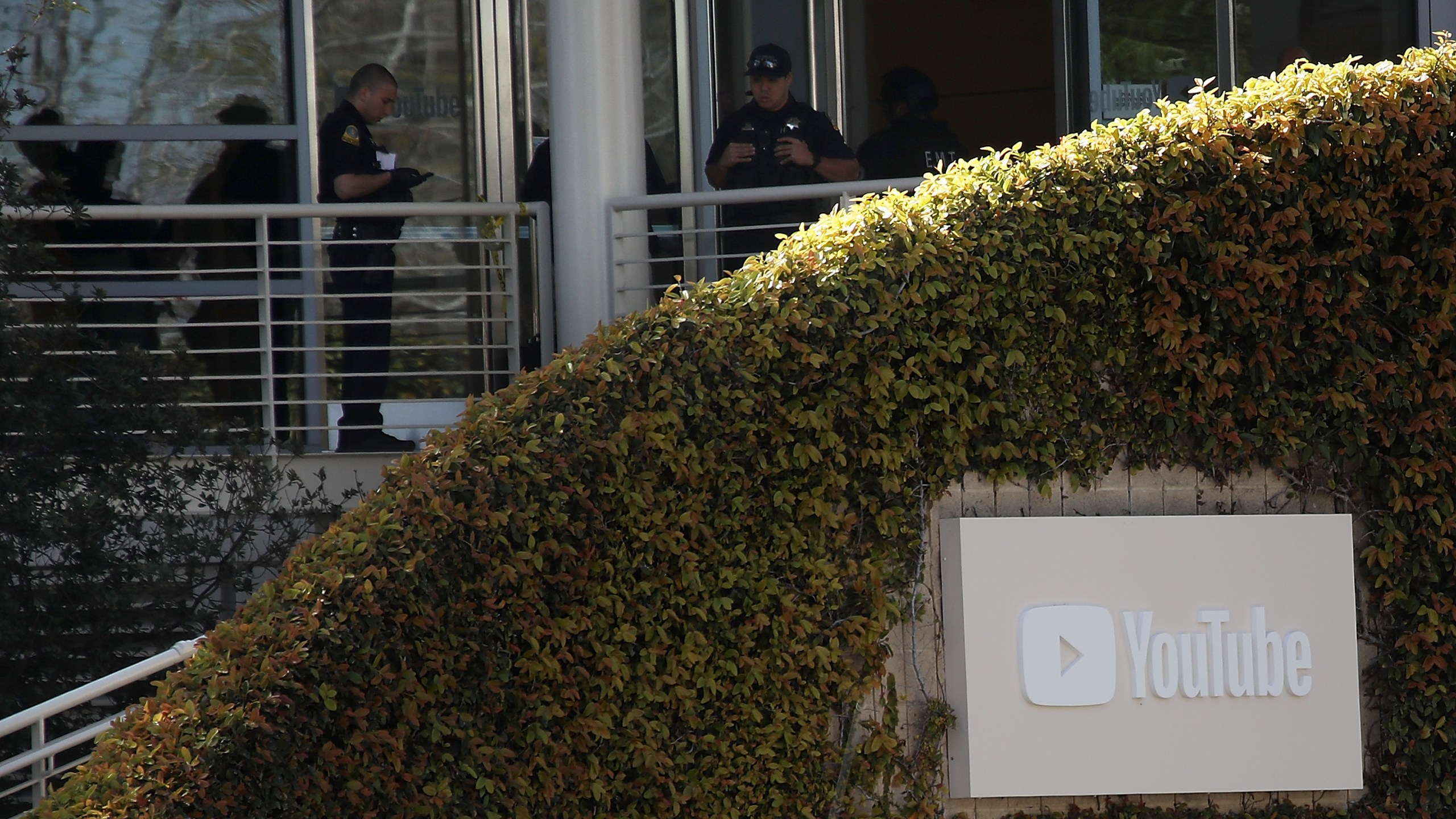 Police officers stand by in front of the YouTube headquarters on April 3, 2018 in San Bruno. (Credit: Justin Sullivan/Getty Images)