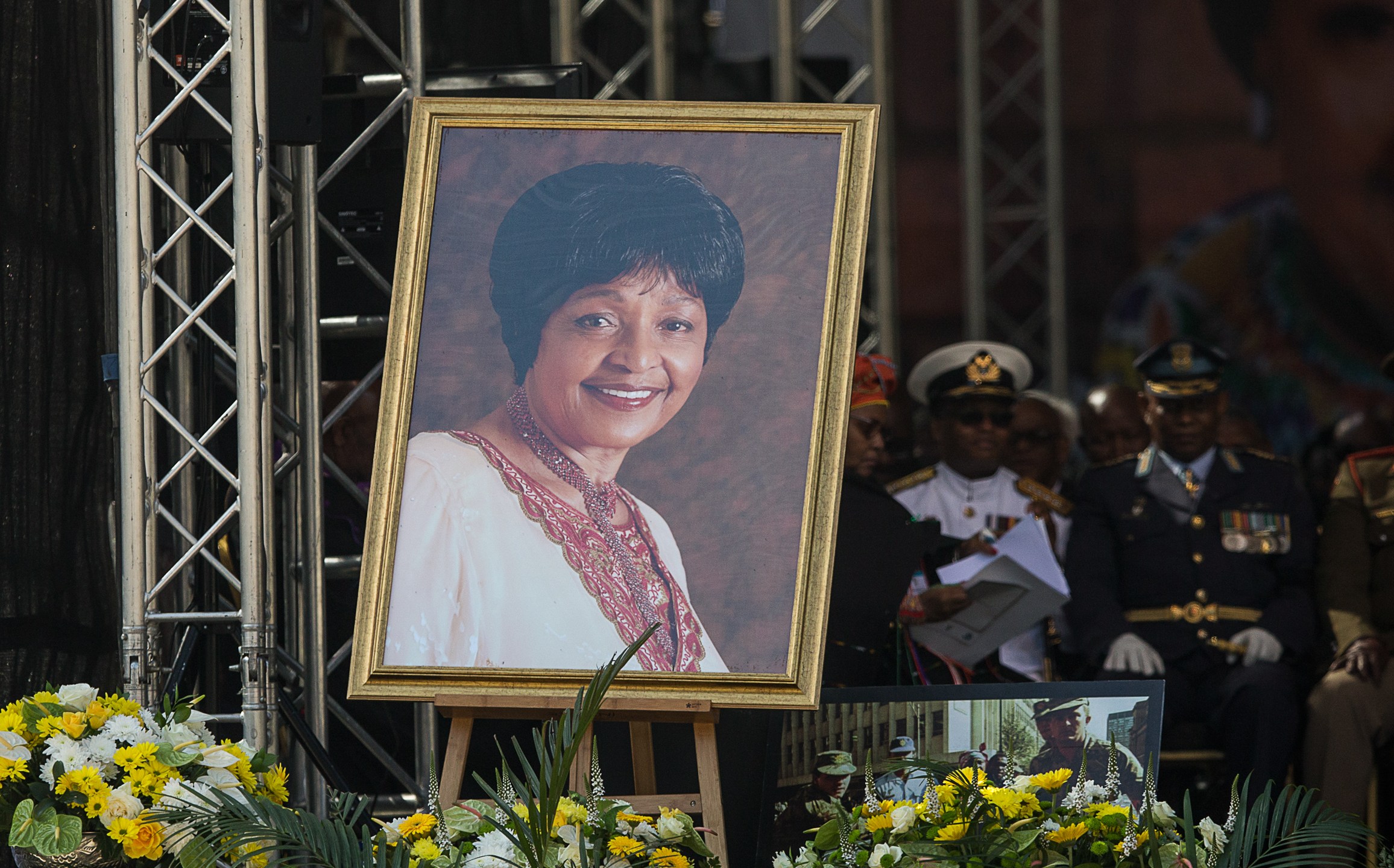 A portrait of Winnie Madikizela-Mandela is displayed on stage during her funeral at the Orlando Stadium in the township of Soweto, concluding 10 days of national mourning on April 14, 2018 in Johannesburg. (Credit: WIKUS DE WET/AFP/Getty Images)