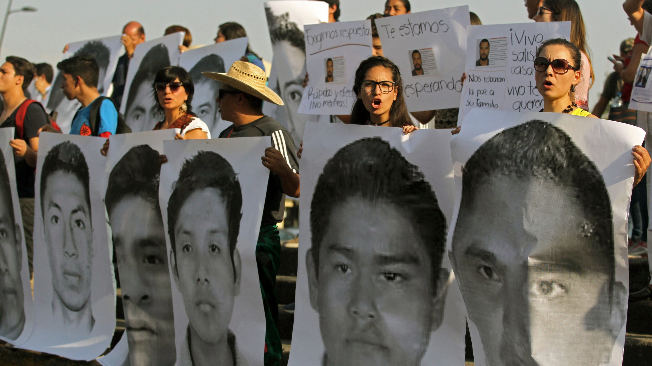 Relatives and friends of three missing students from the University of Audiovisual Media, take part in a demonstration demanding their loved ones to return alive, at the "Ninos heroes" roundabout in Guadalajara, Jalisco State, Mexico, on April 19, 2018. (Credit: ULISES RUIZ/AFP/Getty Images)