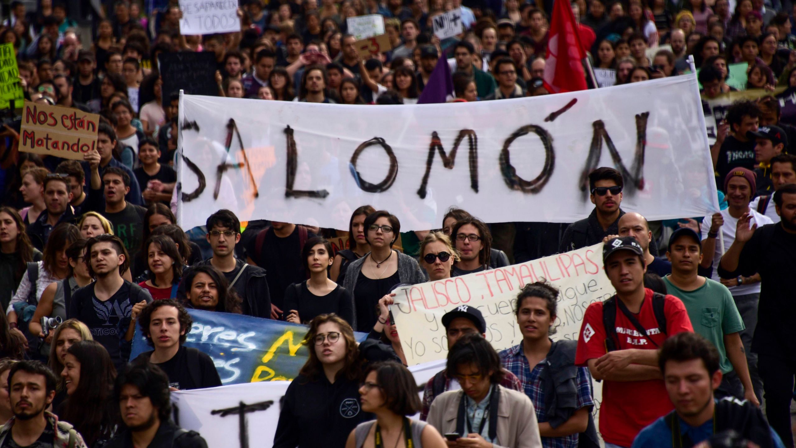 Mexican students take part in a protest against the violence in Mexico and the murder of three students from the University of Audiovisual Media of Guadalajara, in Mexico City, on April 24, 2018. (Credit: Pedro Pardo / AFP / Getty Images)