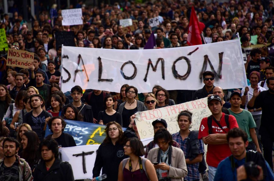 Mexican students take part in a protest against the violence in Mexico and the murder of three students from the University of Audiovisual Media of Guadalajara, in Mexico City, on April 24, 2018. (Credit: Pedro Pardo / AFP / Getty Images)