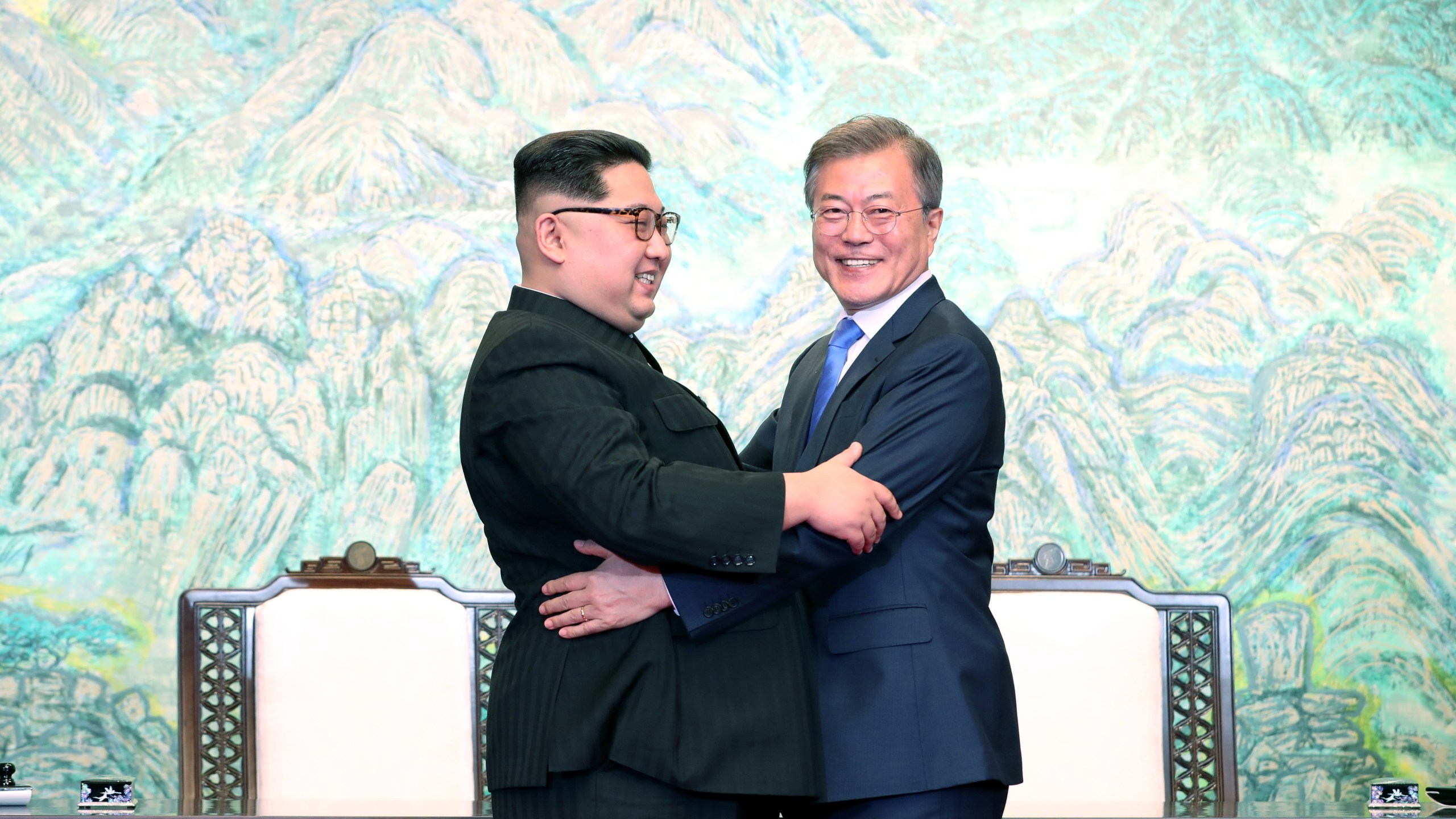 North Korean leader Kim Jong Un and South Korean President Moon Jae-in embrace after signing the Panmunjom Declaration for Peace, Prosperity and Unification of the Korean Peninsula on April 27, 2018. (Credit: Korea Summit Press Pool/Getty Images)