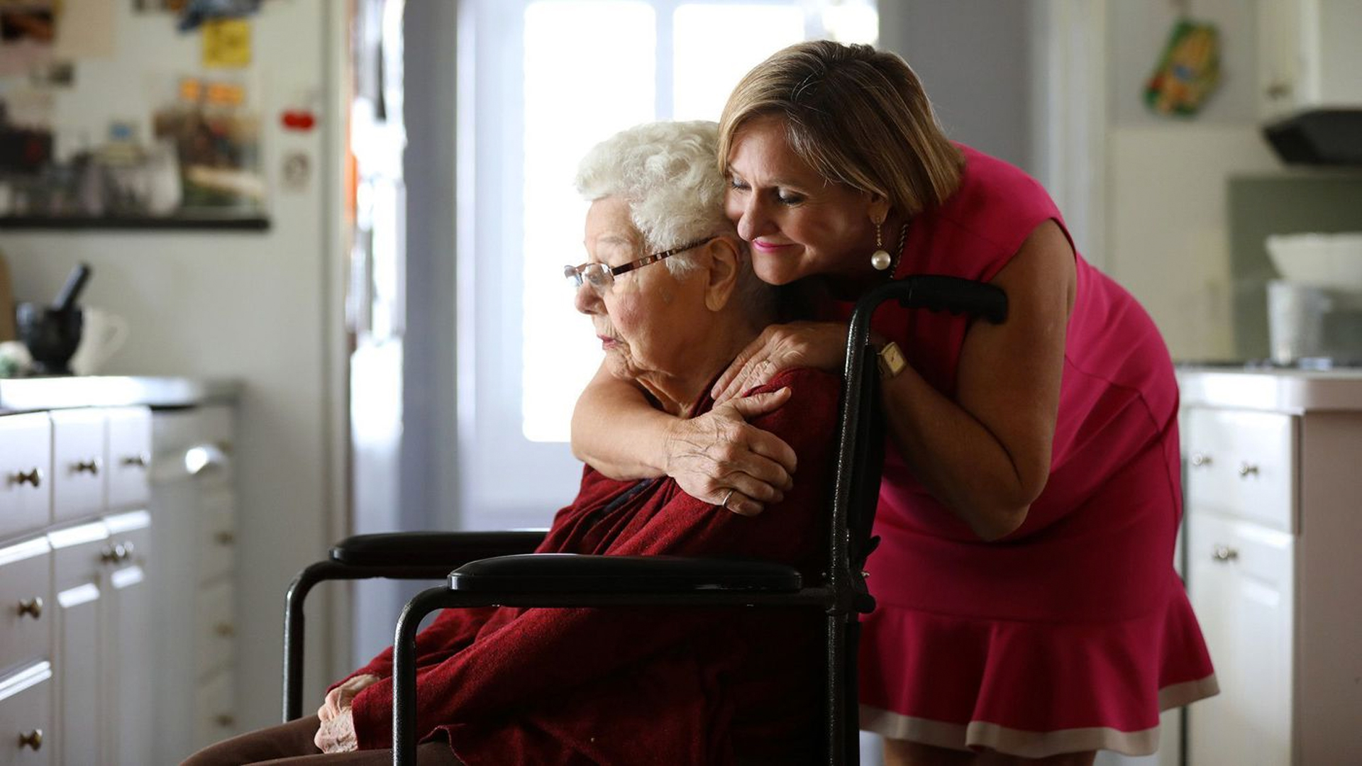 Margaret Wardlow hugs her mother Dolores McKeown, 97, in her McKeown's Cathedral City home. Wardlow was raped by the Golden State Killer in 1977, when she was 13. (Credit: Christina House / Los Angeles Times)