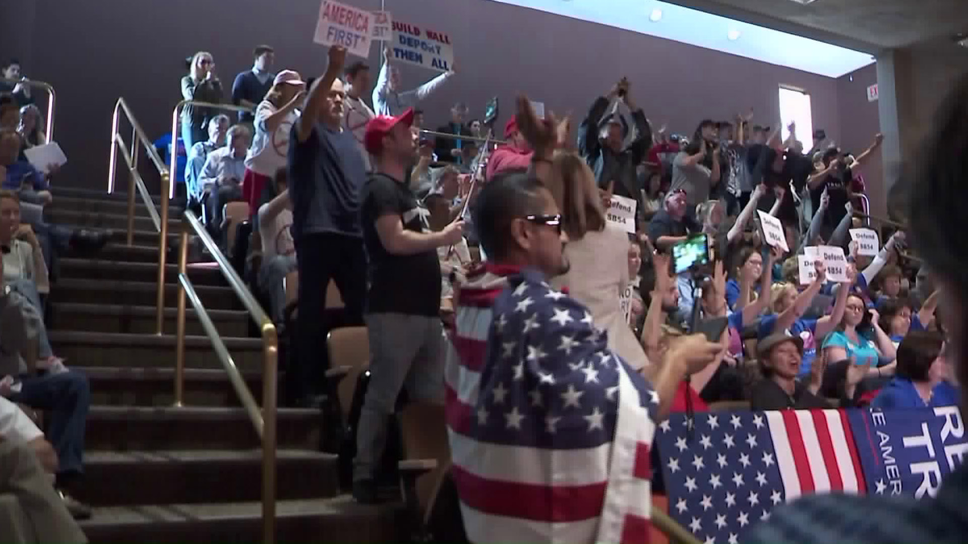 Huntington Beach residents opposing California's "sanctuary" laws attend a city council meeting on April 3, 2018. (Credit: KTLA)