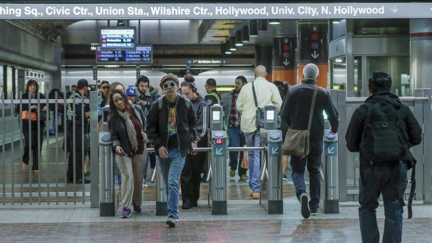 Commuters make their way through turnstiles at the 7th Street and Metro Center station in downtown L.A. (Credit: Irfan Khan / Los Angeles Times)