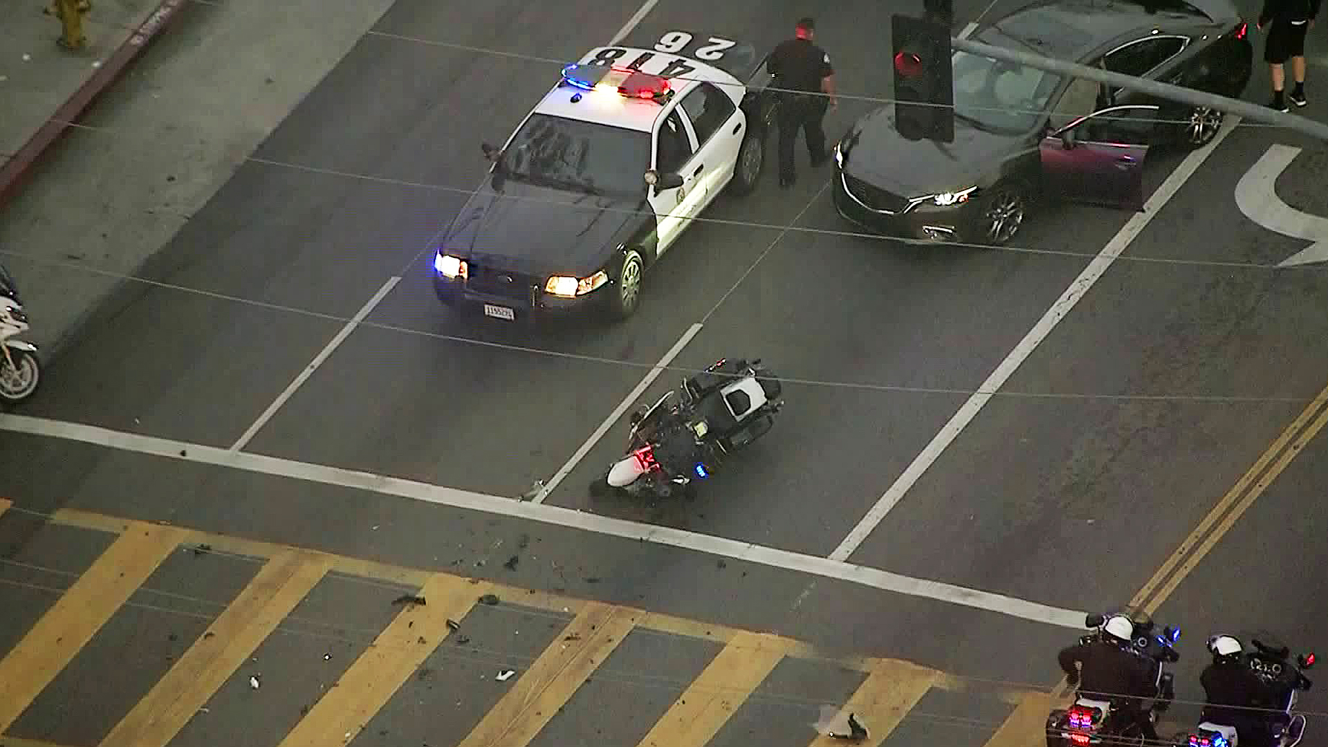 Authorities investigate a crash involving a motorcycle officer in North Hills on April 26, 2018. (Credit: KTLA)