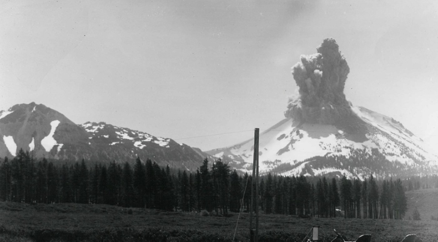 When Lassen Peak exploded on May 22, 1915, it sent a pyroclastic flow flying down the northeast flank of the volcano, creating a zone now known as the Devastated Area. The flow knocked trees down and destroyed everything in its path — 3 square miles of wilderness was obliterated. In this file photo, ash and smoke spew from Mt. Lassen. (Credit: National Park Service)