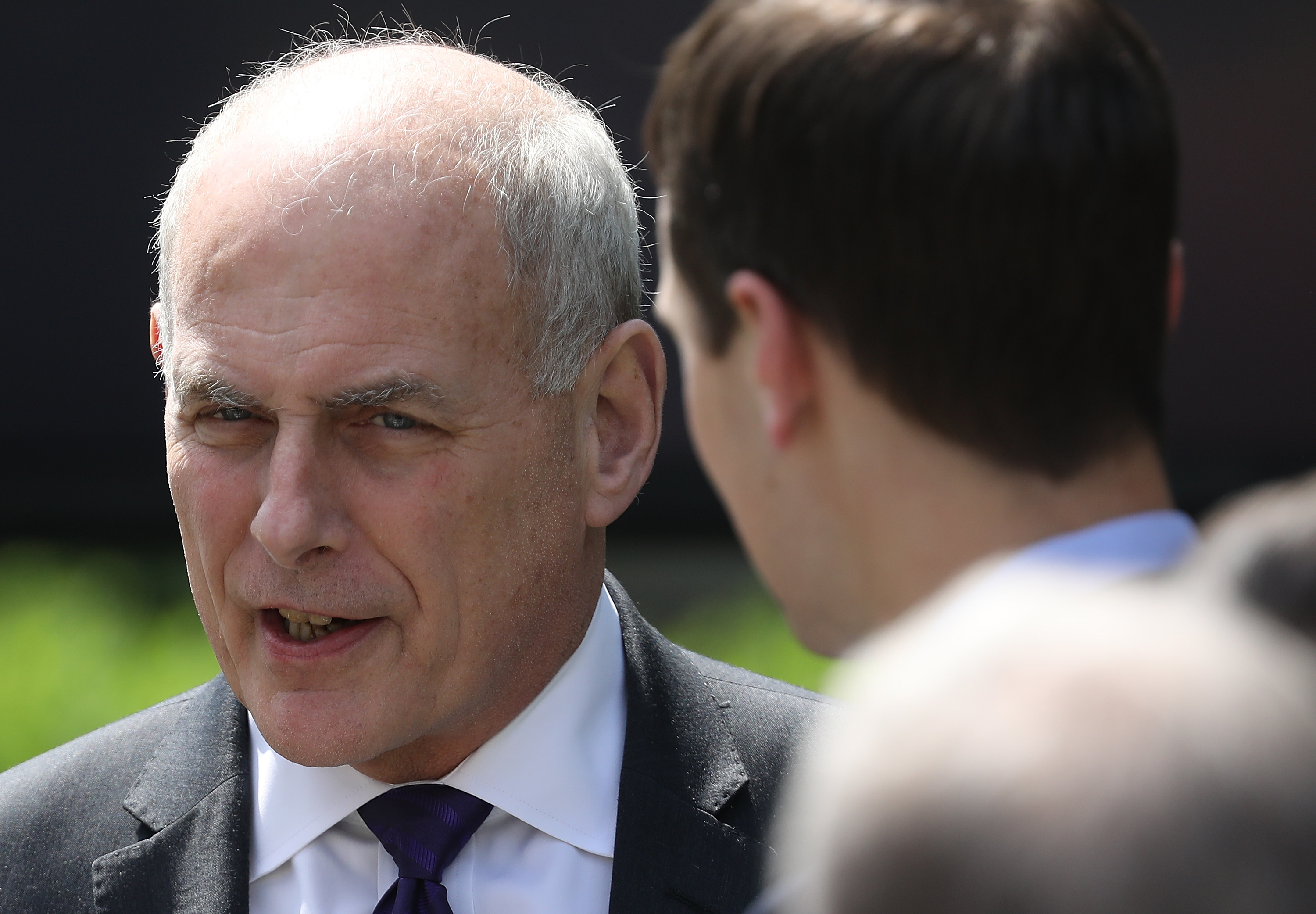 White House Chief of Staff John Kelly, left, speaks with senior White House adviser Jared Kushner at an event where Melania Trump spoke in the Rose Garden of the White House, May 7, 2018. (Credit: Win McNamee / Getty Images)