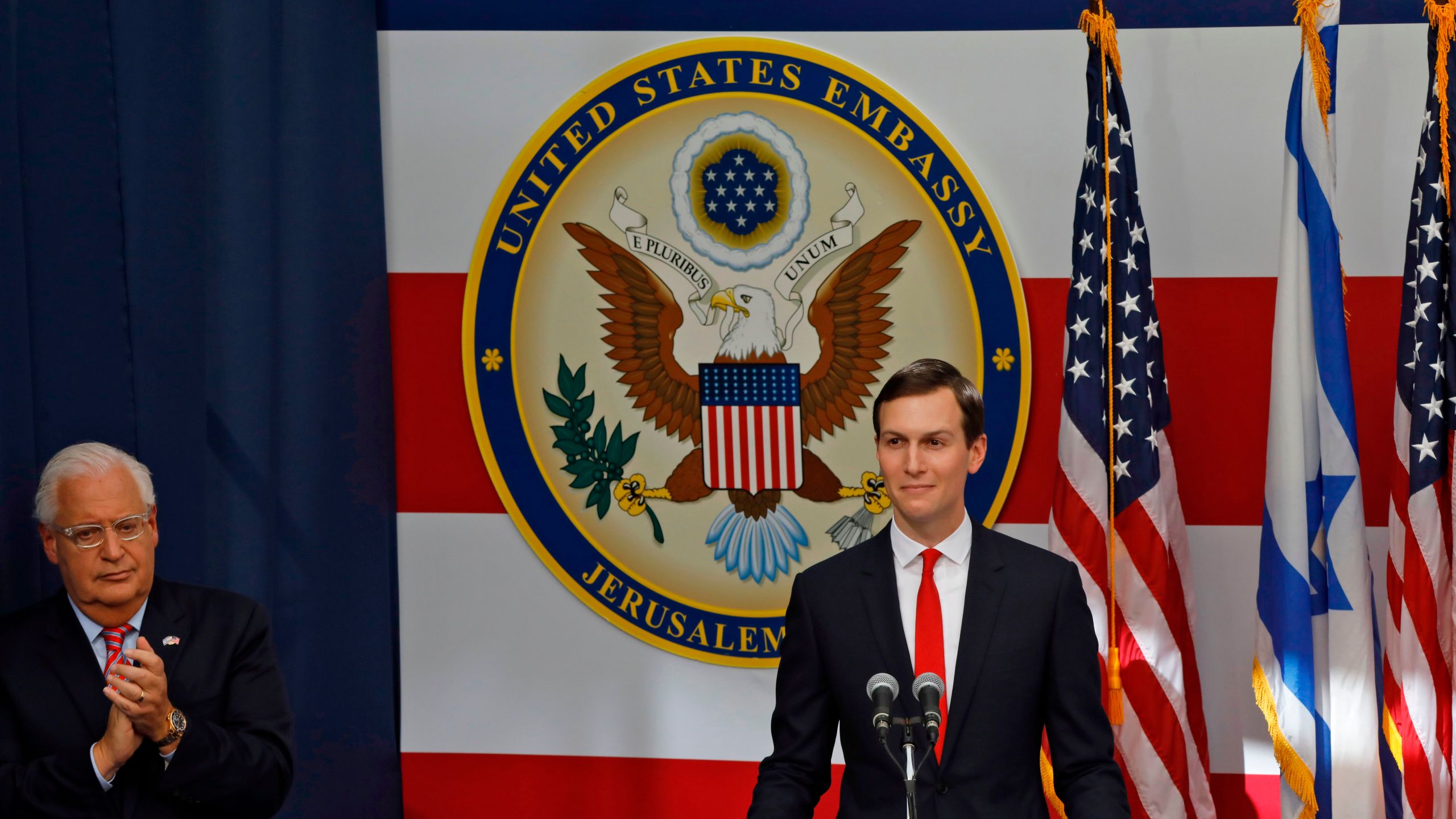 US ambassador to Israel David Friedman claps as Senior White House Advisor Jared Kushner delivers a speech during the opening of the US embassy in Jerusalem on May 14, 2018. (Credit: MENAHEM KAHANA/AFP/Getty Images)