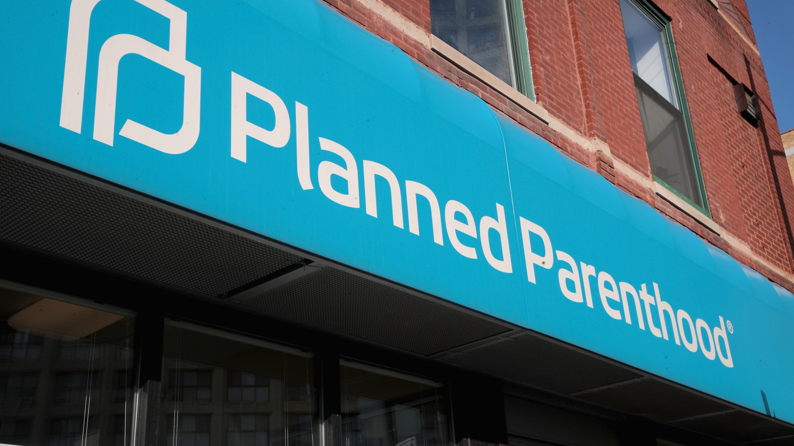 A sign hangs above a Planned Parenthood clinic on May 18, 2018 in Chicago, Illinois. (Credit: Scott Olson/Getty Images)