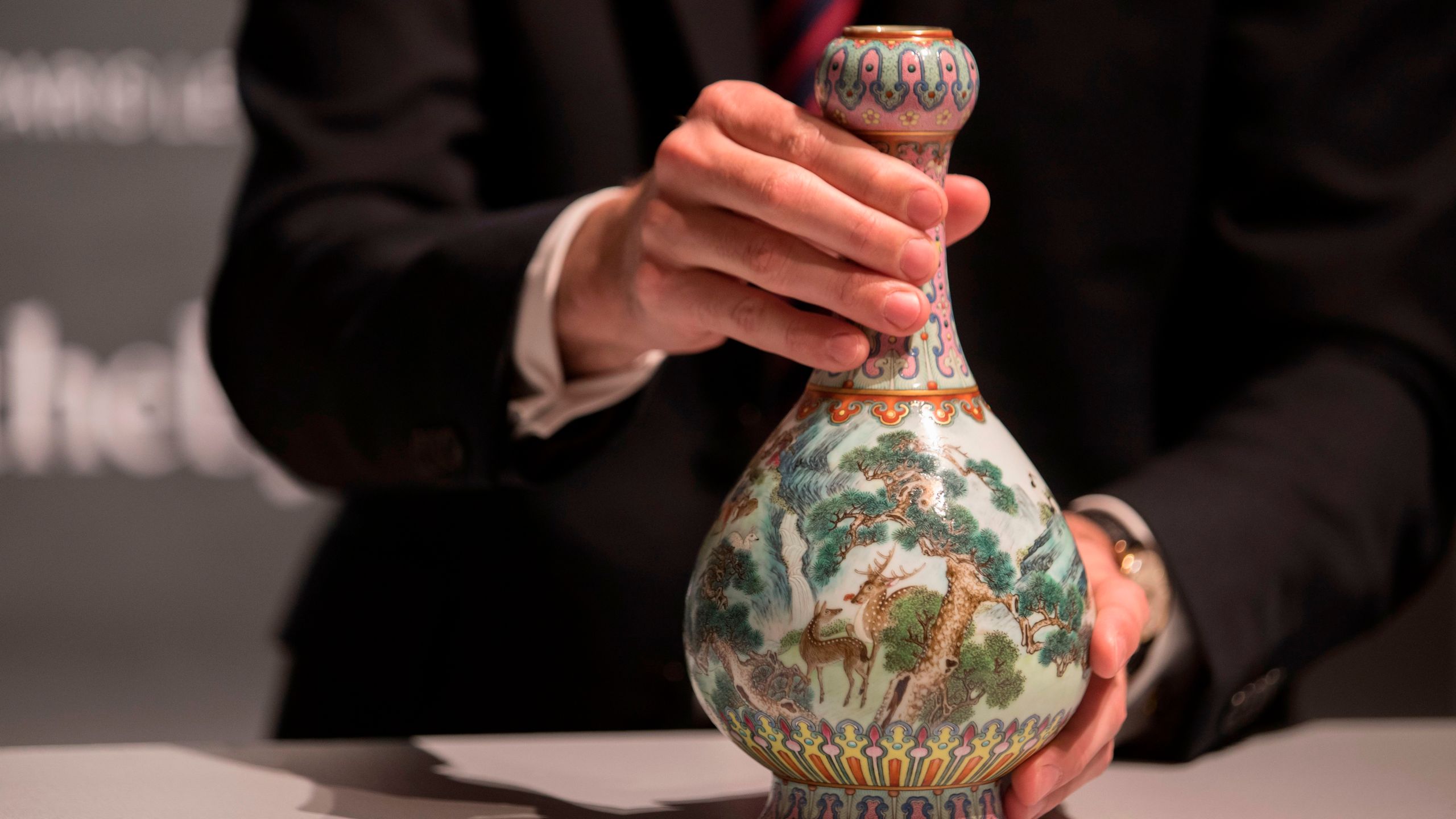 A rare Imperial Qianlong porcelain vase is displayed at Sotheby's auction company in Paris, on May 22, 2018. The vase, which was stored in a shoebox in an attic for decades, will be sold at Sotheby's Paris on June. (Credit: THOMAS SAMSON/AFP/Getty Images)