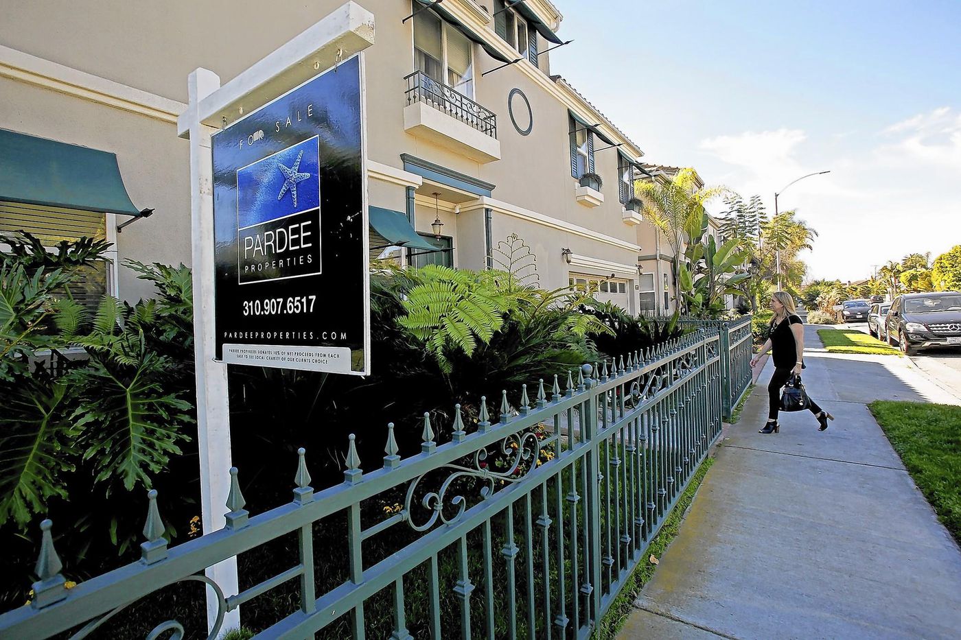 An undated photo shows a for sale sign at a residential property in California. (Credit: Anne Cusack / Los Angeles Times)