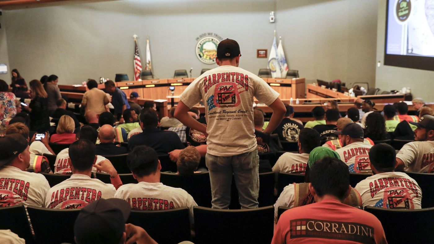 People wearing union shirts were out in large numbers during the Anaheim City Council meeting on June 19, 2018, as the council decided to put a controversial "living wage" measure on the November ballot. (Credit: Jay L. Clendenin / Los Angeles Times)