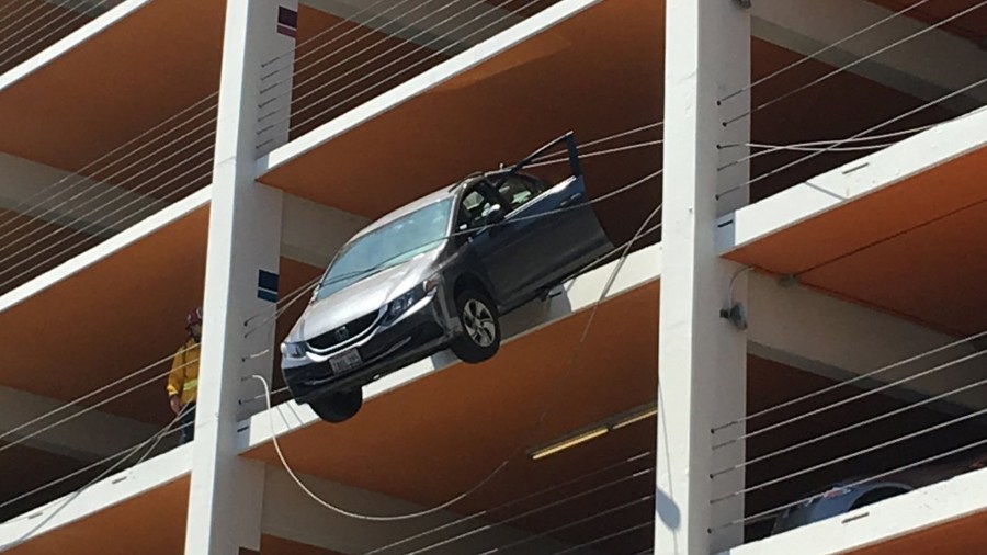 A car was dangling from a Santa Monica parking structure on June 11, 2018. (Courtesy Merle Stadnyk)