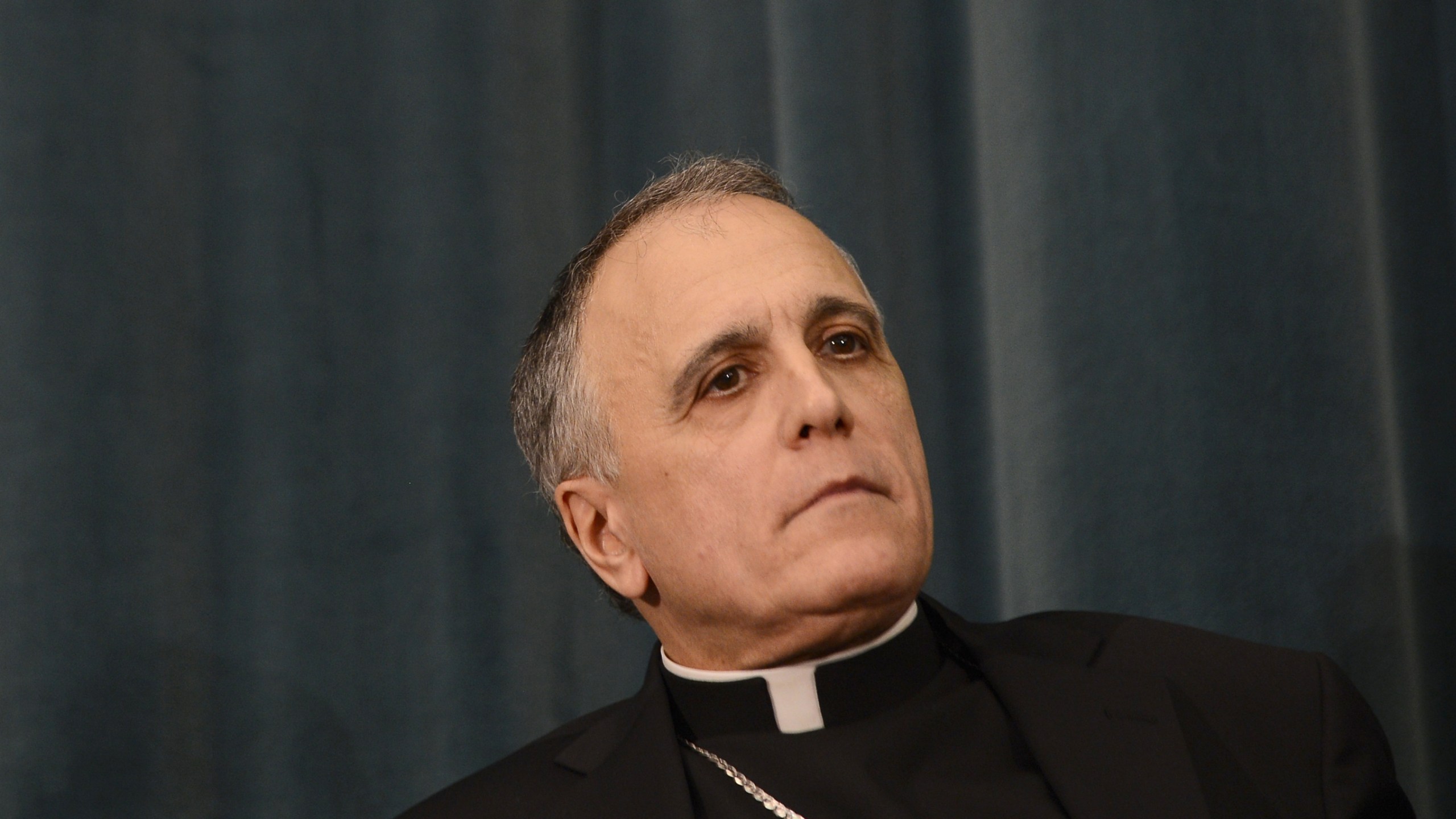 U.S. cardinal Daniel DiNardo listens during a press conference at the North American College on March 5, 2013 in Rome. (Credit: Andreas Solaro/AFP/Getty Images)