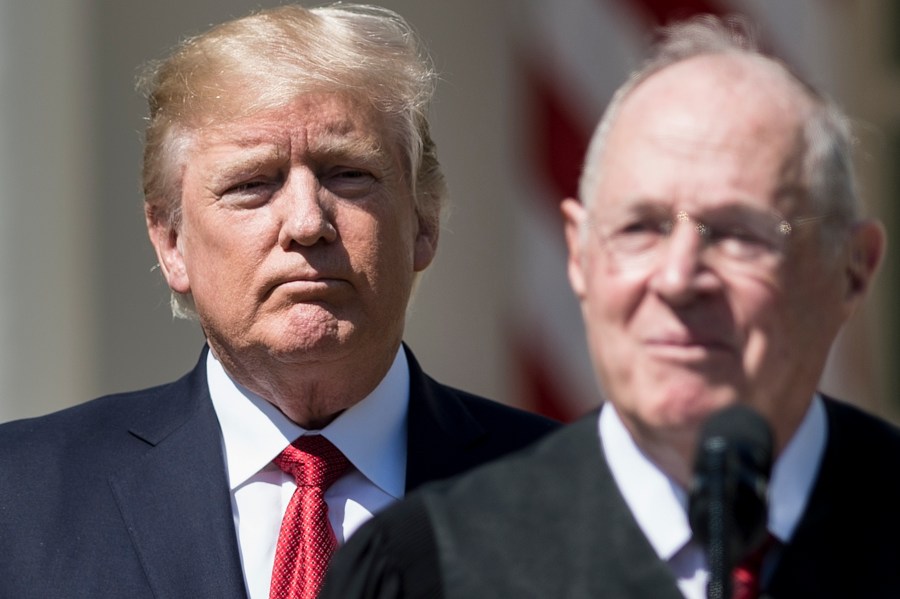 Donald Trump listens while Supreme Court Justice Anthony Kennedy speaks during a ceremony in the Rose Garden of the White House April 10, 2017 in Washington, D.C. (Credit: BRENDAN SMIALOWSKI/AFP/Getty Images)