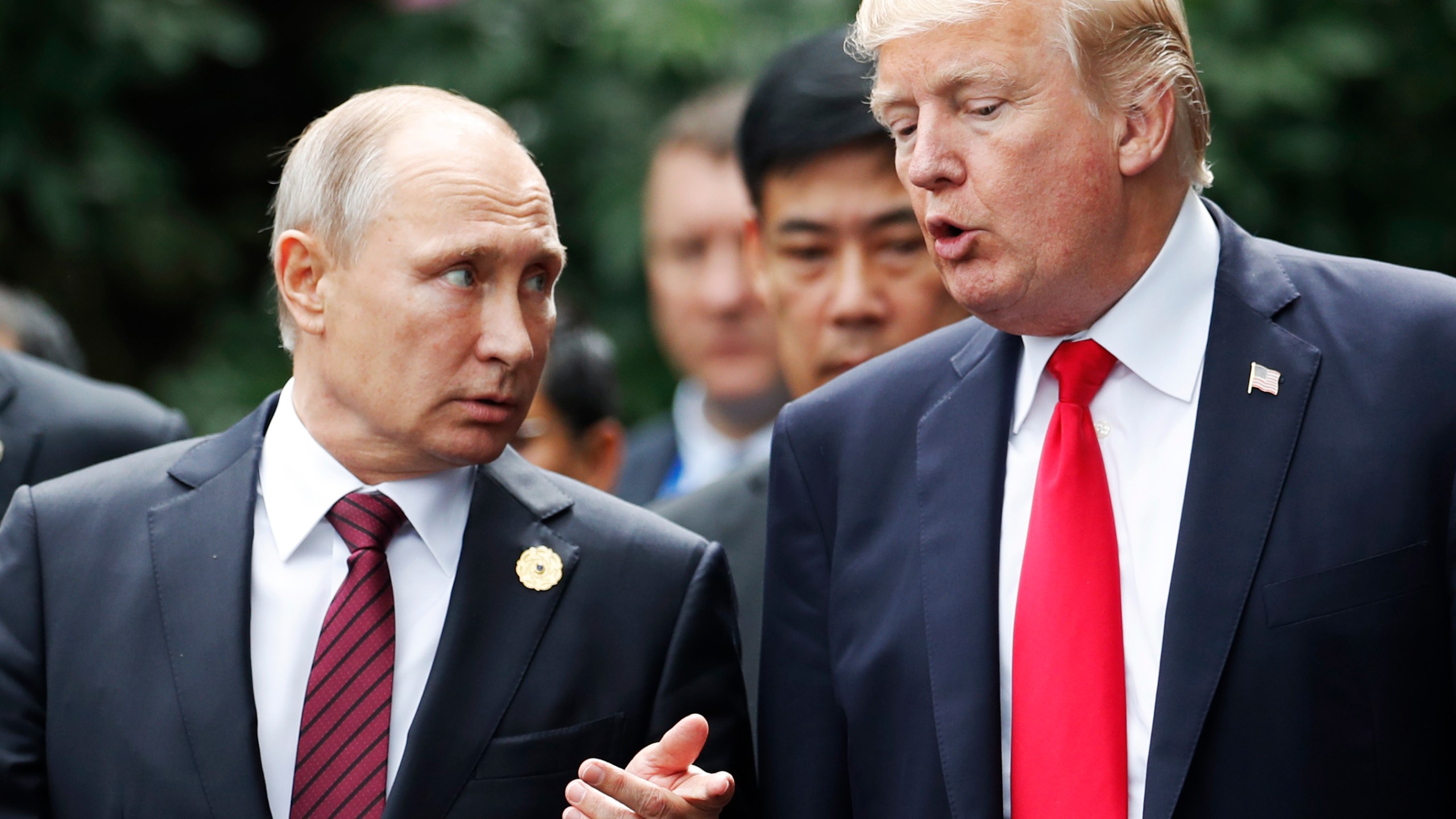 US President Donald Trump (R) and Russia's President Vladimir Putin talk in the central Vietnamese city of Danang on November 11, 2017. (Credit: JORGE SILVA/AFP/Getty Images)