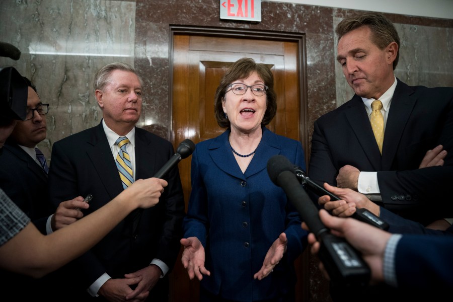 (Left to Right) Sen. Lindsey Graham (R-SC), Sen. Susan Collins (R-ME) and Sen. Jeff Flake (R-AZ) talk to reporters after a meeting with a bipartisan group of moderate Senators on Jan. 22, 2018. (Credit: Drew Angerer/Getty Images)