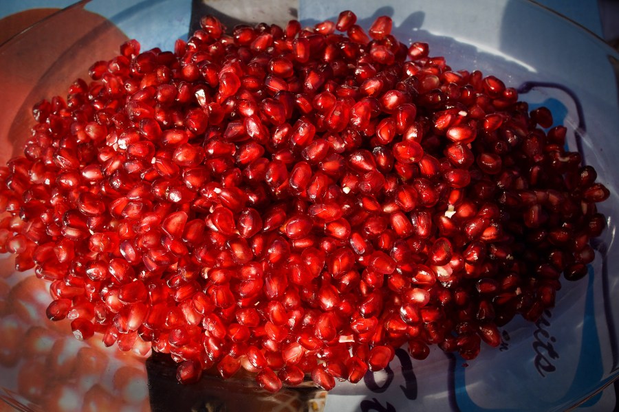 Pomegranates seeds are displayed on a plate in this file photo. (Credit: Paula Bronstein/Getty Images)