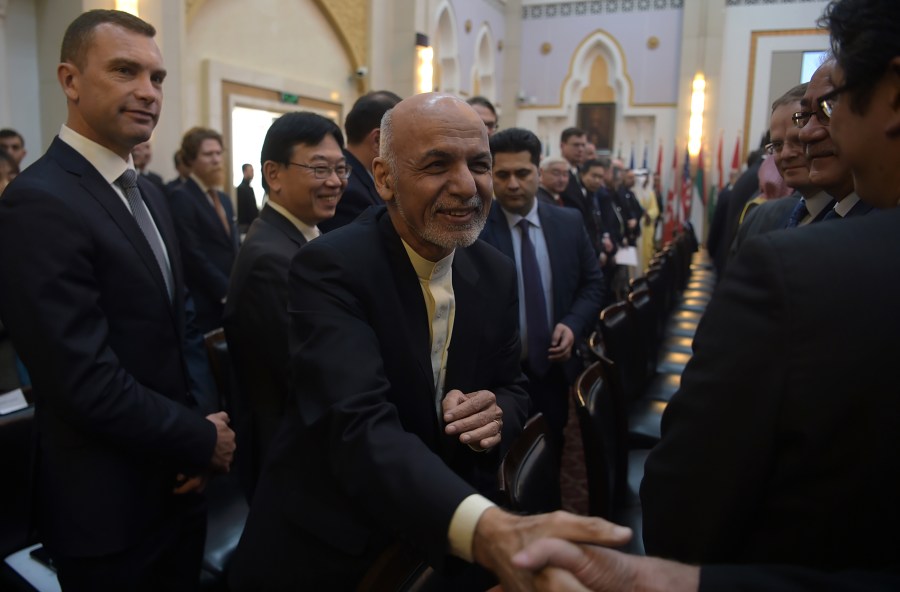 Afghan President Ashraf Ghani shakes hands with a foreign delegate at the second Kabul Process conference at the Presidential Palace in Kabul on February 28, 2018. (Credit: Shah Marai ARAI/AFP/Getty Images)