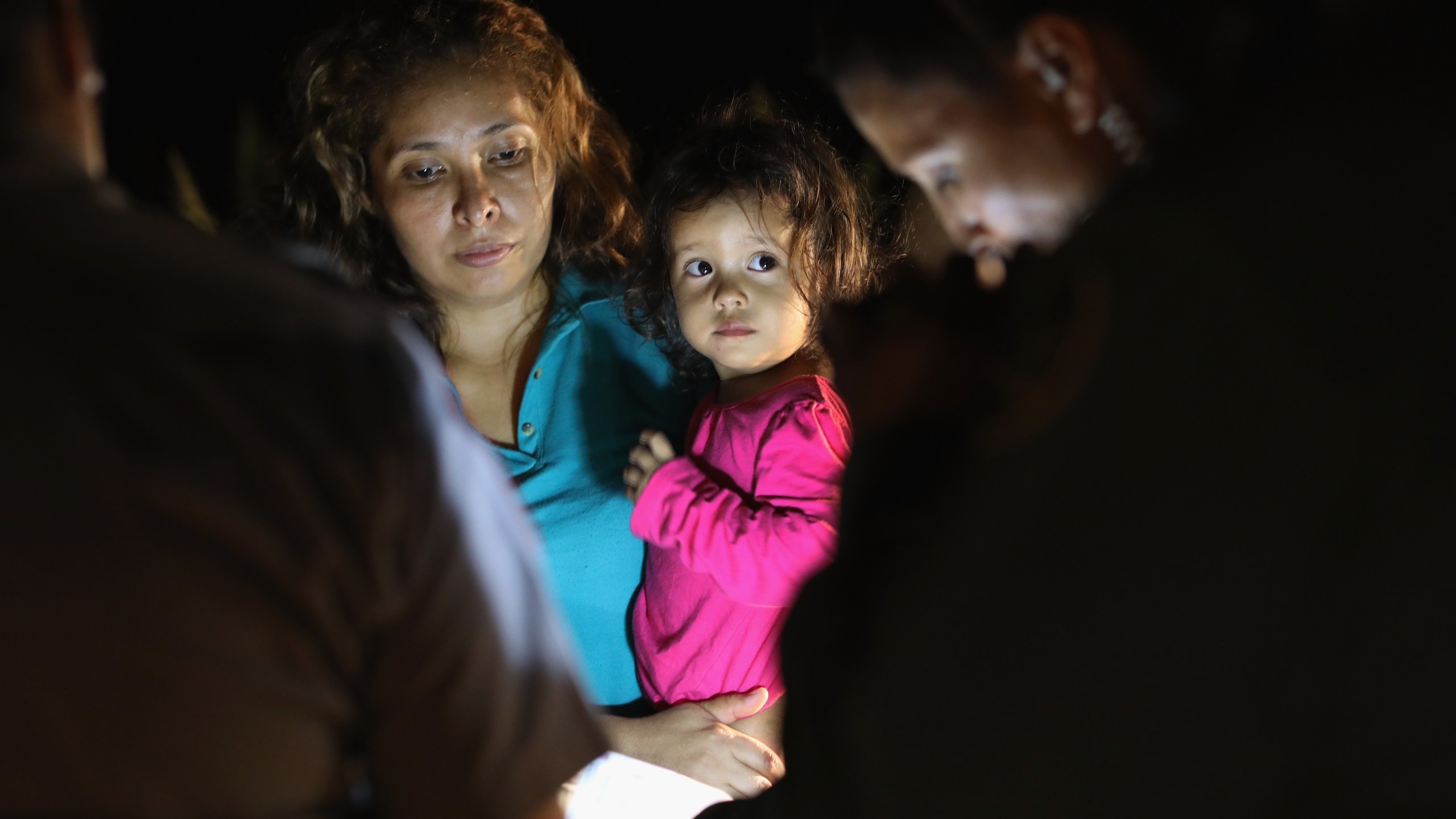 Central American asylum seekers, including a Honduran girl, 2, and her mother, are taken into custody near the U.S.-Mexico border on June 12, 2018, in McAllen, Texas. (Credit: John Moore / Getty Images)