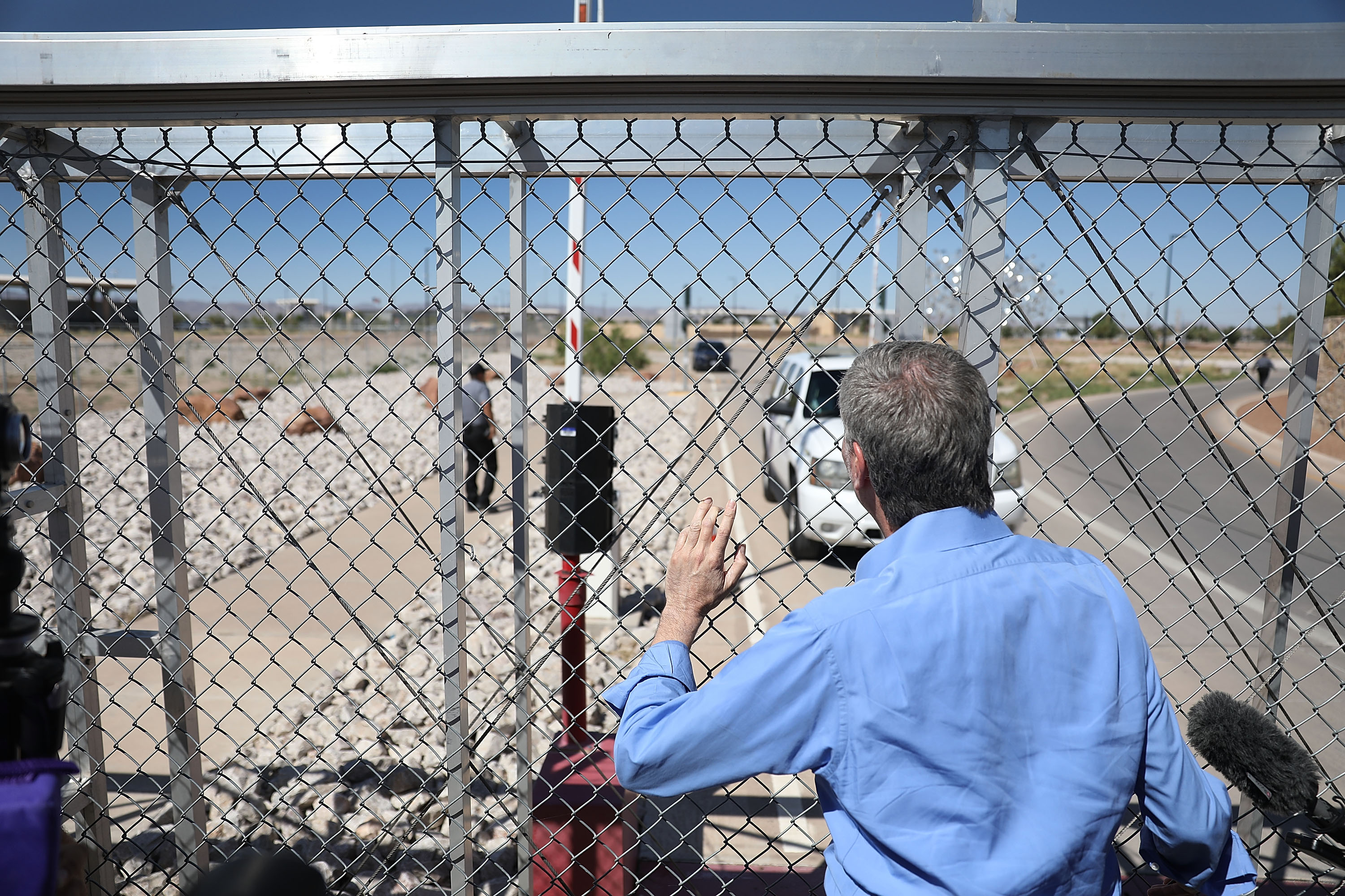 New York City Mayor Bill de Blasio stops at a gate after being told he could not cross through the gate at the Tornillo-Guadalupe Port of Entry as he joins with other mayors from the U.S. Conference of Mayors to call for the immediate reunification of separated immigrant families on June 21, 2018, in Fabens, Texas. (Credit: Joe Raedle/Getty Images)