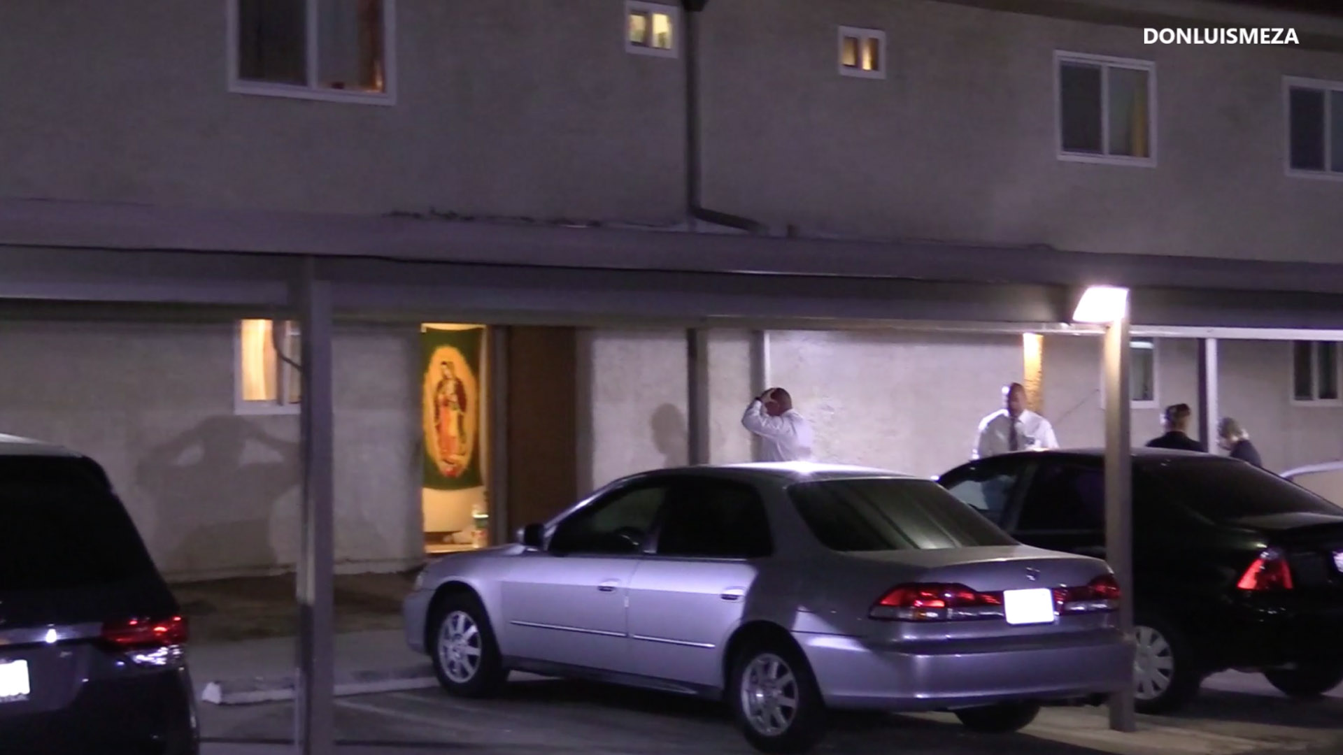 Detectives investigate at an apartment in Lancaster after an injured 10-year-old boy was taken to a hospital. The child later died. (Credit: DonLuisMeza)