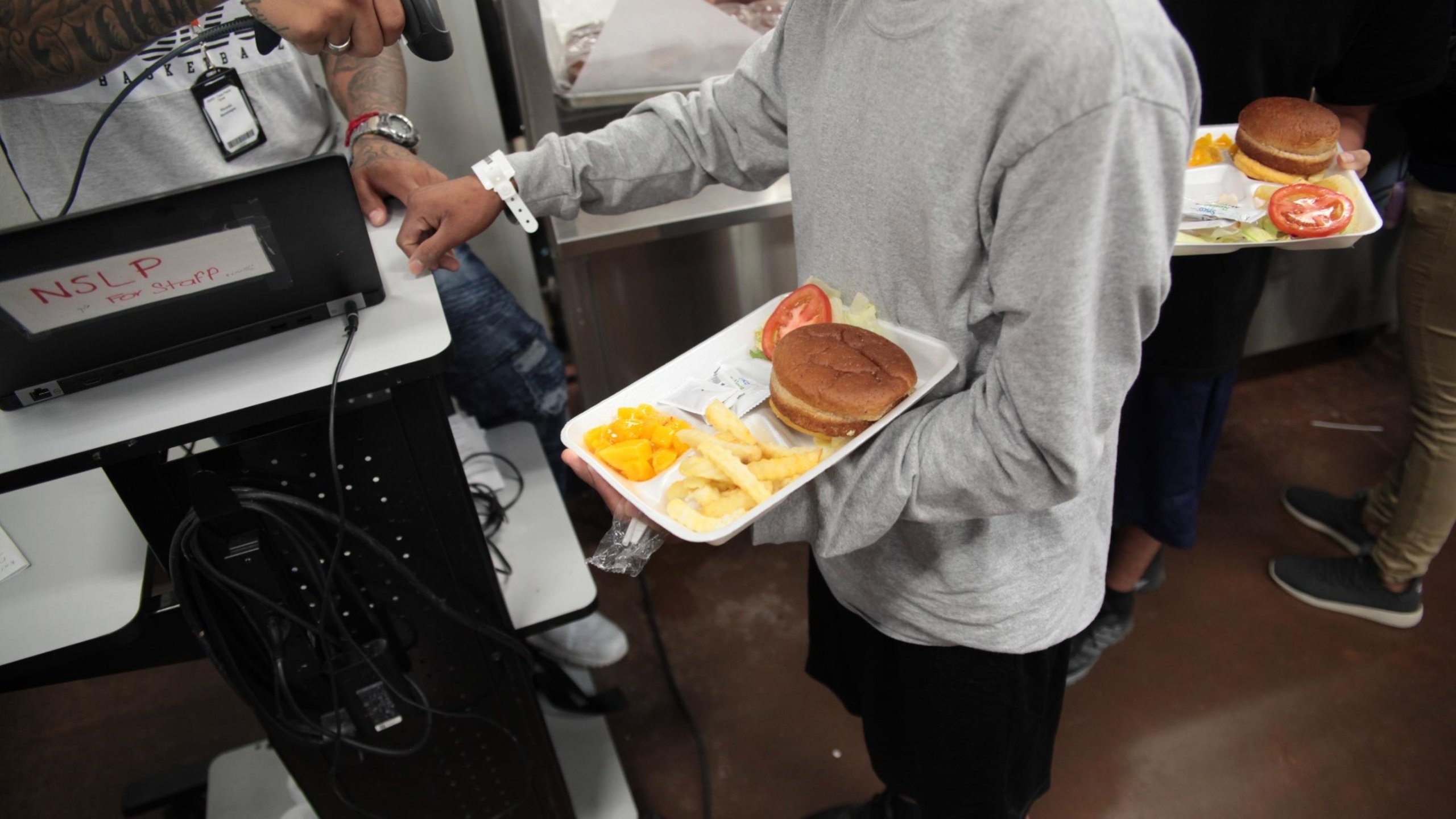 A child receives a meal at the Casa Padre shelter in Brownsville, Texas, in an undated photo released by the Department of Health and Human Services.