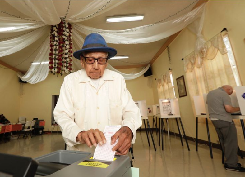 Thomas Alvarez casts his ballot at First Mexican Baptist Church in East Los Angeles on June 5, 2018. (Credit: Irfan Khan / Los Angeles Times)