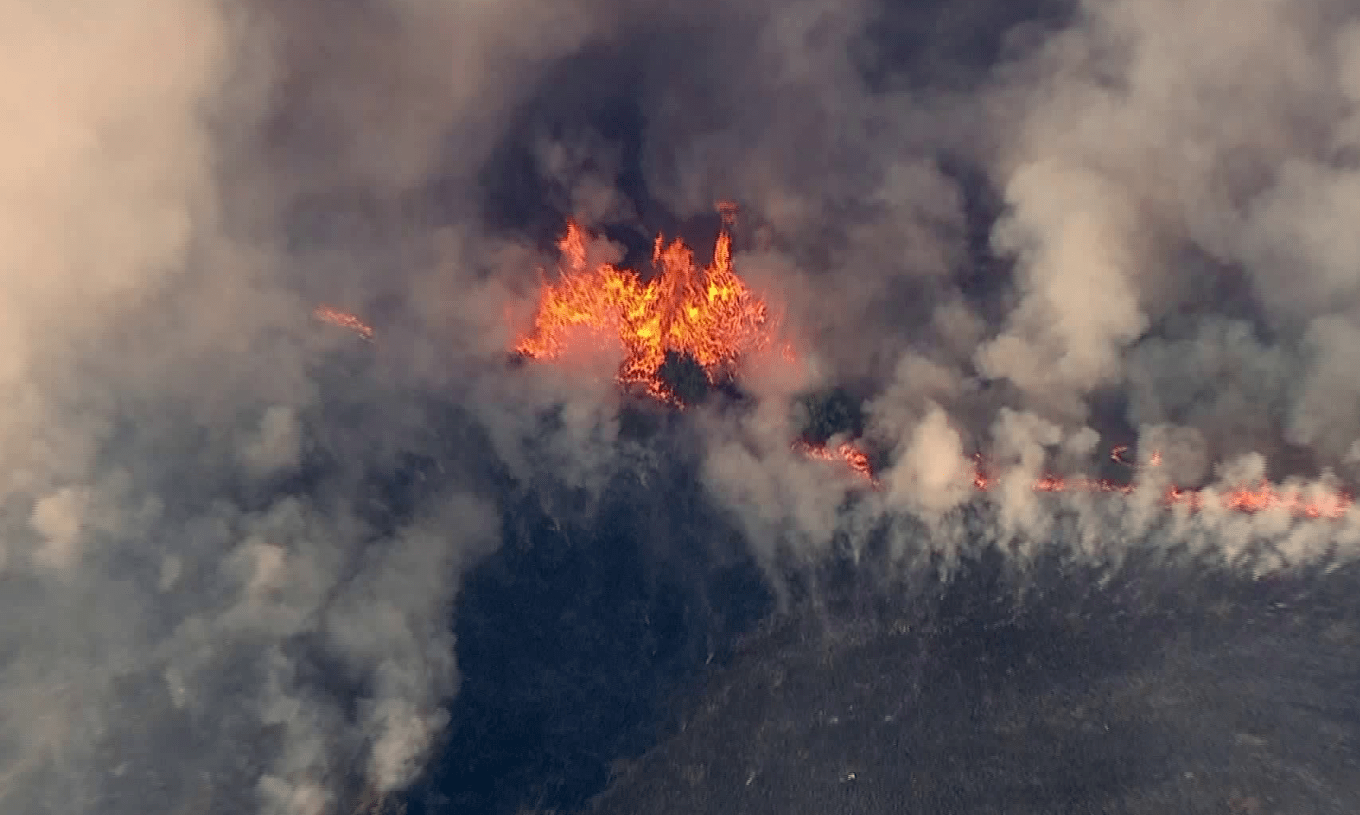 A brush fire burns near Santiago Canyon on June 11, 2018. (Credit: KTLA)