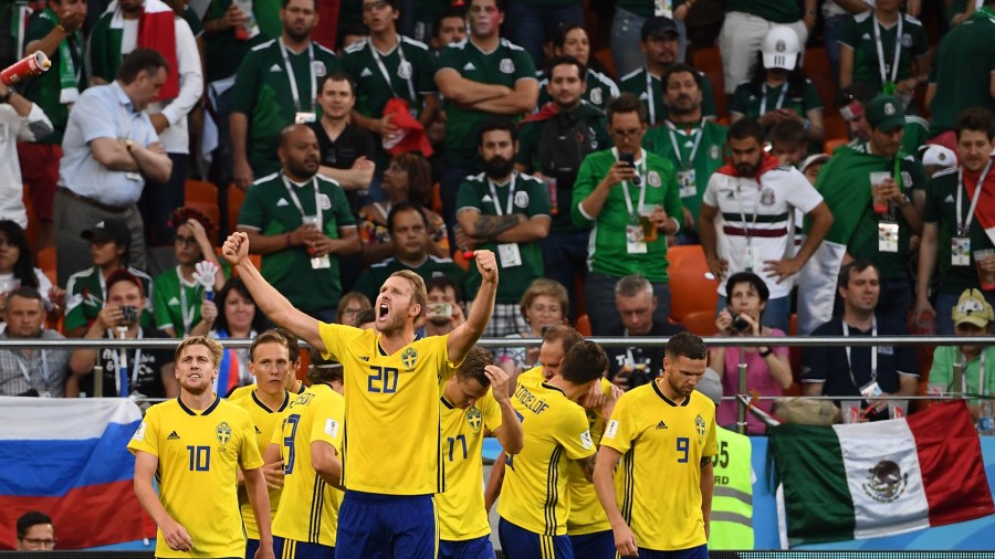 Sweden's players celebrate the team's second goal scored from the penalty spot during the Russia 2018 World Cup Group F football match between Mexico and Sweden at the Ekaterinburg Arena in Ekaterinburg on June 27, 2018. (Credit: ANNE-CHRISTINE POUJOULAT/AFP/Getty Images)