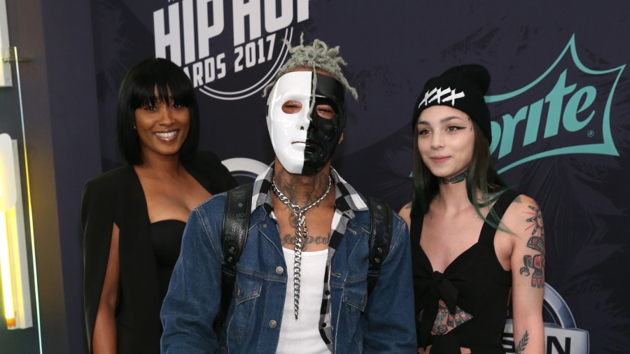 Rapper XXXTentacion, center, attended the BET Hip Hop Awards 2017 at The Fillmore Miami Beach at the Jackie Gleason Theater on October 6, 2017 in Miami Beach, Florida. (Credit: Bennett Raglin/Getty Images for BET )