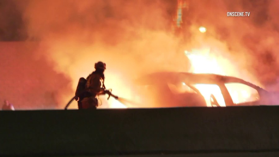 Firefighters respond to a fatal crash on the 605 Freeway in Norwalk on July 16, 2018. (Credit: OnScene.TV)