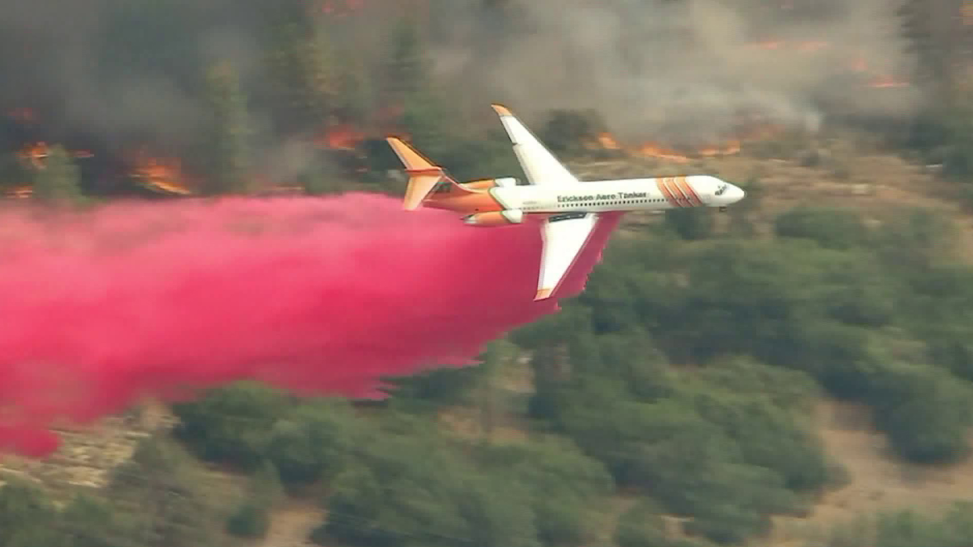 An air tanker drops retardant on the Cranston Fire on July 27, 2018. (Credit: KTLA)