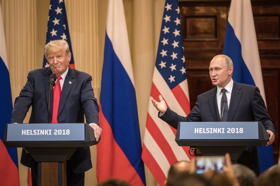 U.S. President Donald Trump, left, and Russian President Vladimir Putin answer questions about the 2016 U.S Election collusion during a joint press conference after their summit on July 16, 2018, in Helsinki, Finland. (Credit: Chris McGrath/Getty Images)