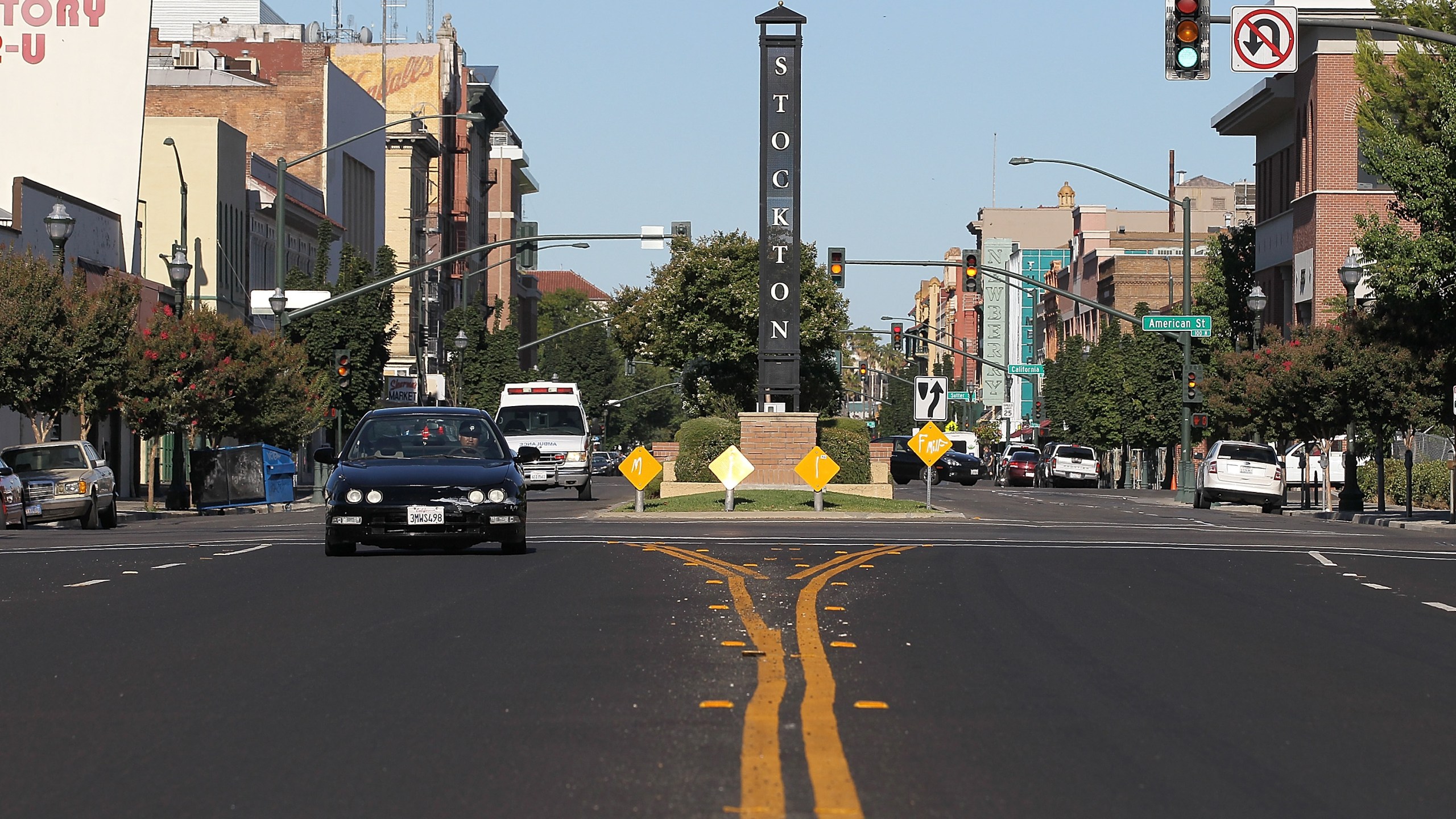 Cars drive by a sign on June 27, 2012, in Stockton, Calif. (Credit: Justin Sullivan/Getty Images)