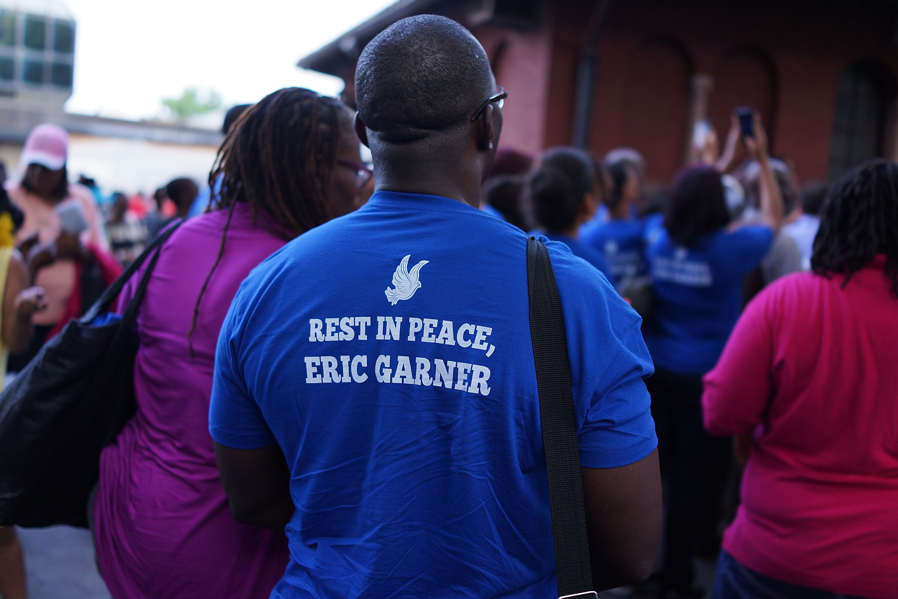 People attend a vigil for Eric Garner near where he died after he was taken into police custody in Staten Island last Thursday on July 22, 2014, in New York City. (Credit: Spencer Platt/Getty Images)