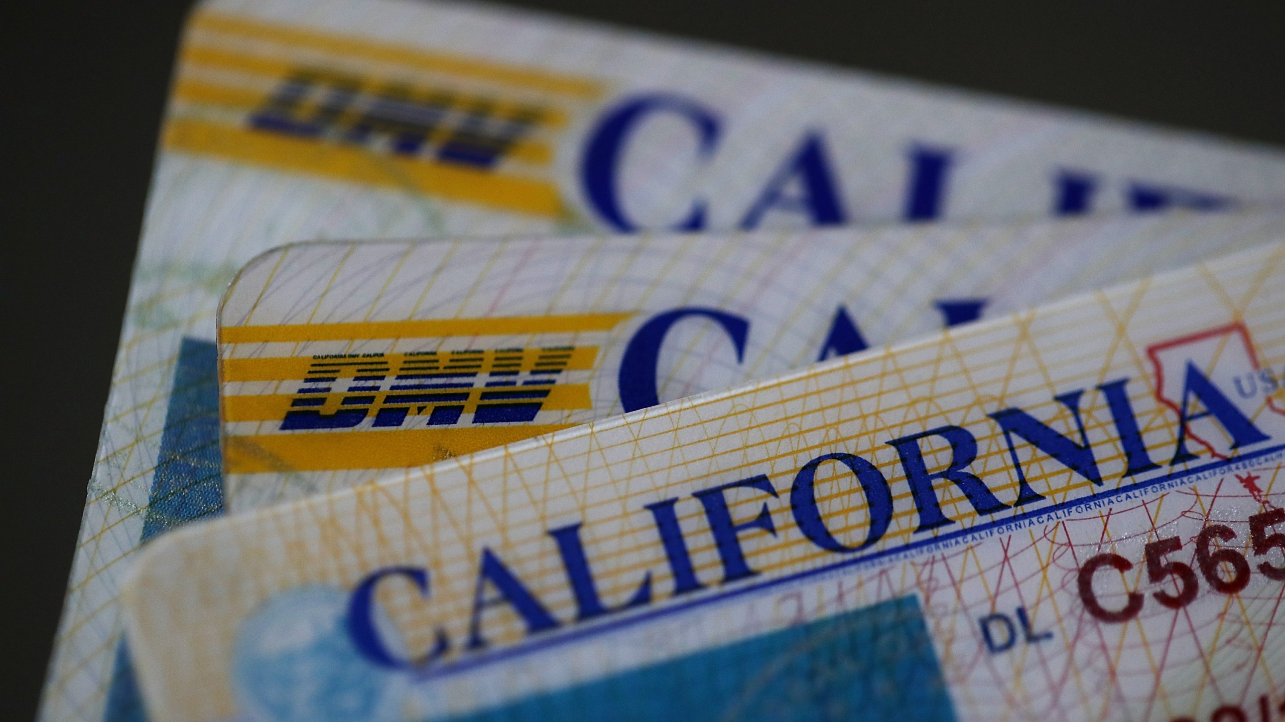 In this photo illustration, the California Department of Motor Vehicles (DMV) logo appears on a California driver license on May 9, 2017, in San Anselmo. (Credit: Justin Sullivan/Getty Images)