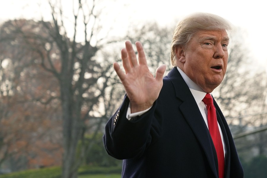 Donald Trump gestures as he speaks to members of the media on former national security adviser Michael Flynn's lying to the FBI prior to his Marine One departure from the South Lawn of the White House Dec. 4, 2017 in Washington, D.C. (Credit: Alex Wong/Getty Images)