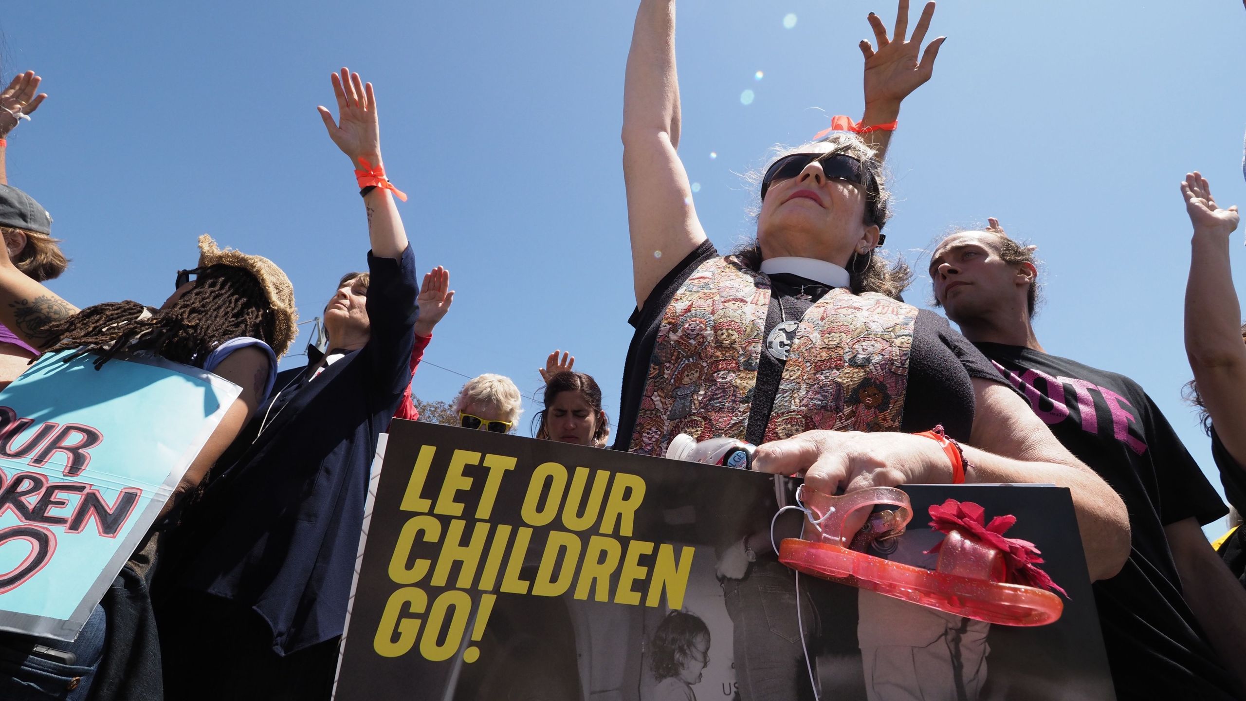 Protestors pray outside the Otay Mesa Detention Center during a demonstration against U.S. immigration policy that separates children from parents, in San Diego on June 23, 2018. (Credit: ROBYN BECK/AFP/Getty Images)