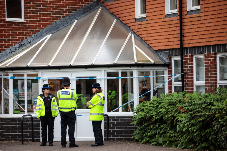 Officials convene at the scene outside Amesbury Baptist Centre as Wiltshire Police declare a major incident after a man and woman were exposed to an unknown substance on July 4, 2018, in Amesbury, England. (Credit: Jack Taylor / Getty Images)