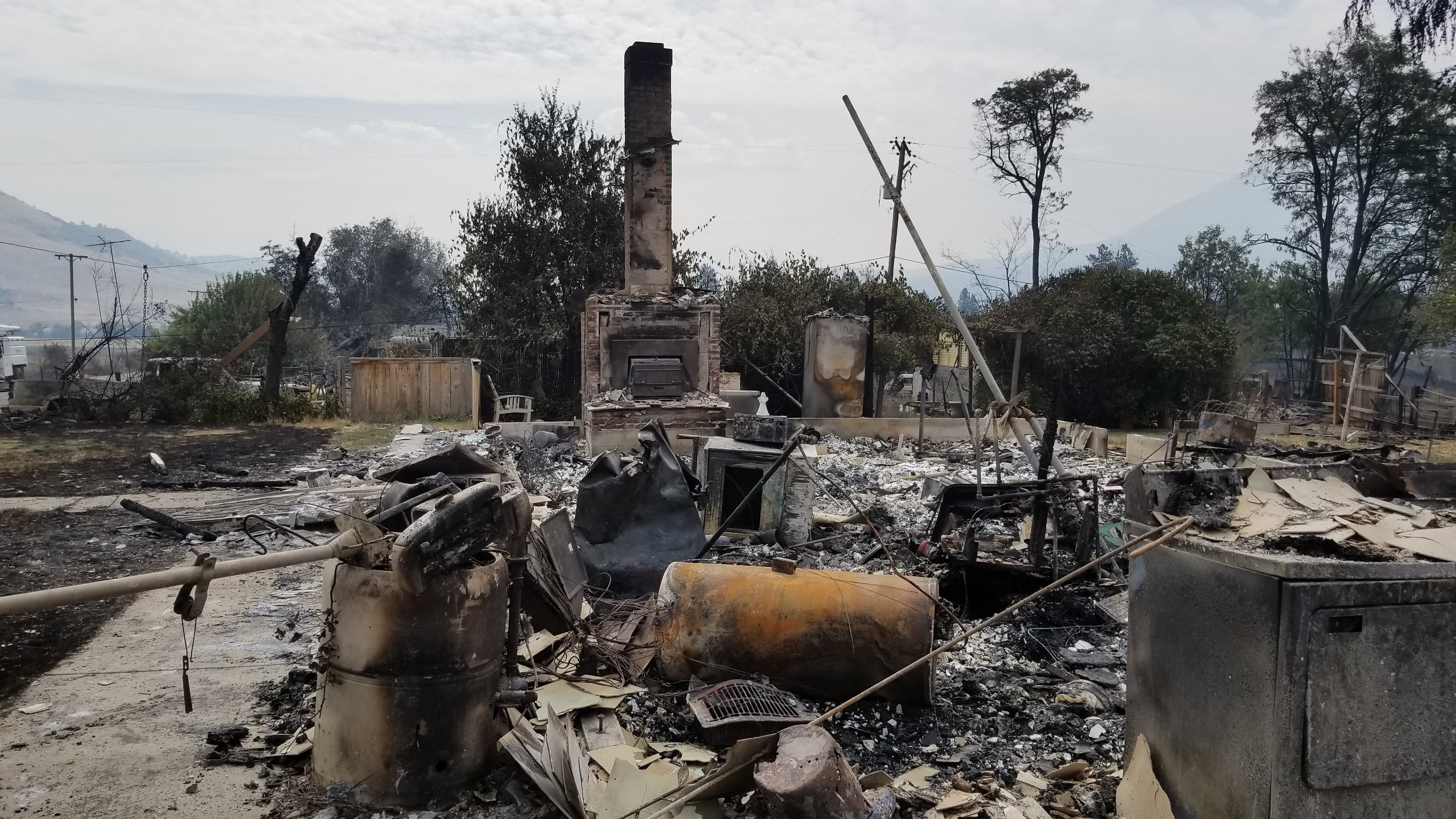 A photo shows the remnants of a home devoured by the Klamathon Fire in Hornbrook, Calif., on July 6, 2018. (Credit: Mario Montalvo/KHSL via CNN)