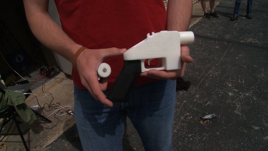 A man holds a 3-D printed gun in this undated photo. (Credit: CNN)