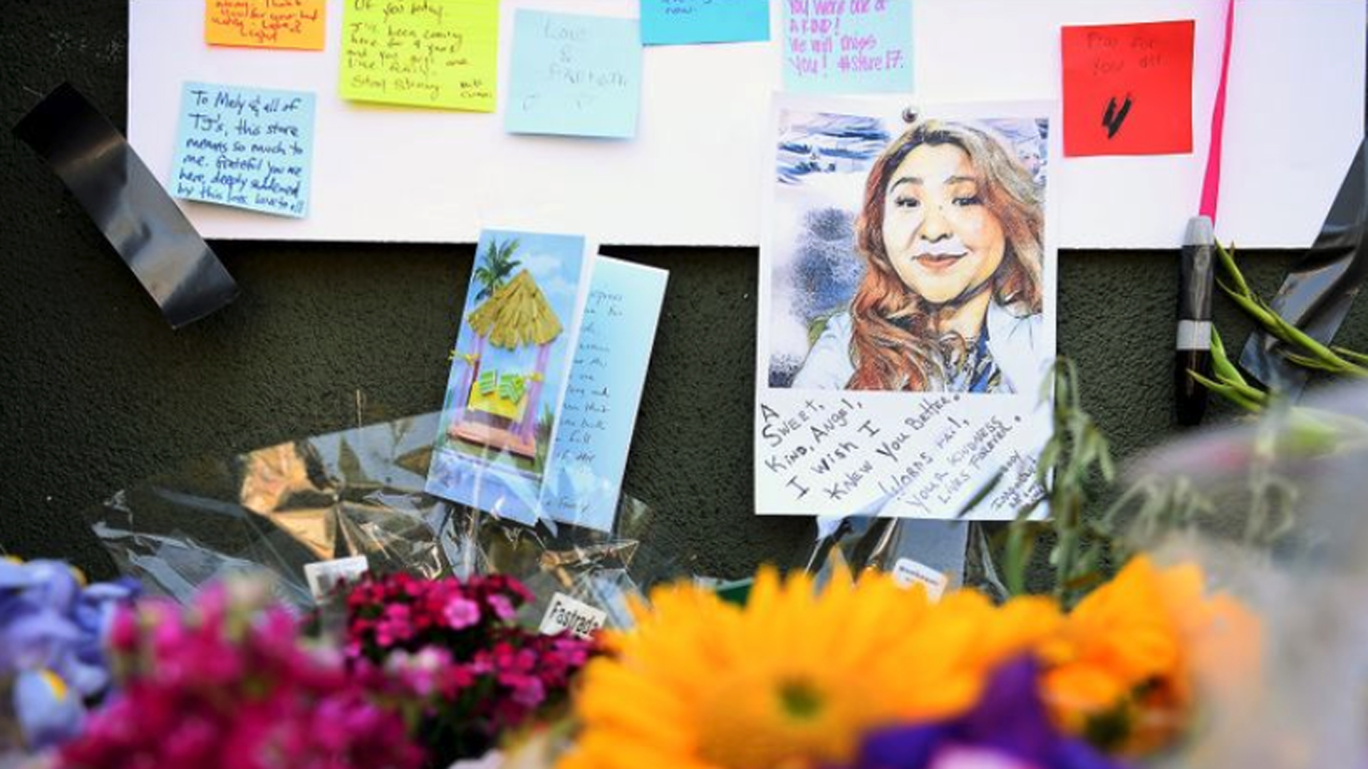 A portrait of Melyda Corado is pinned to a memorial outside Trader Joe's in Silver Lake. (Christina House / Los Angeles Times)