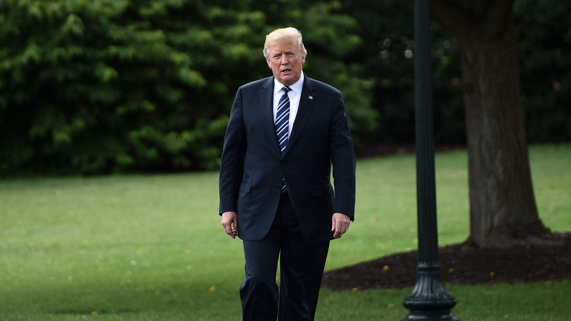 President Donald Trump walks to a “Made in America” showcase event at the White House gardens on July 23, 2018. (Credit: BRENDAN SMIALOWSKI/AFP/Getty Images)