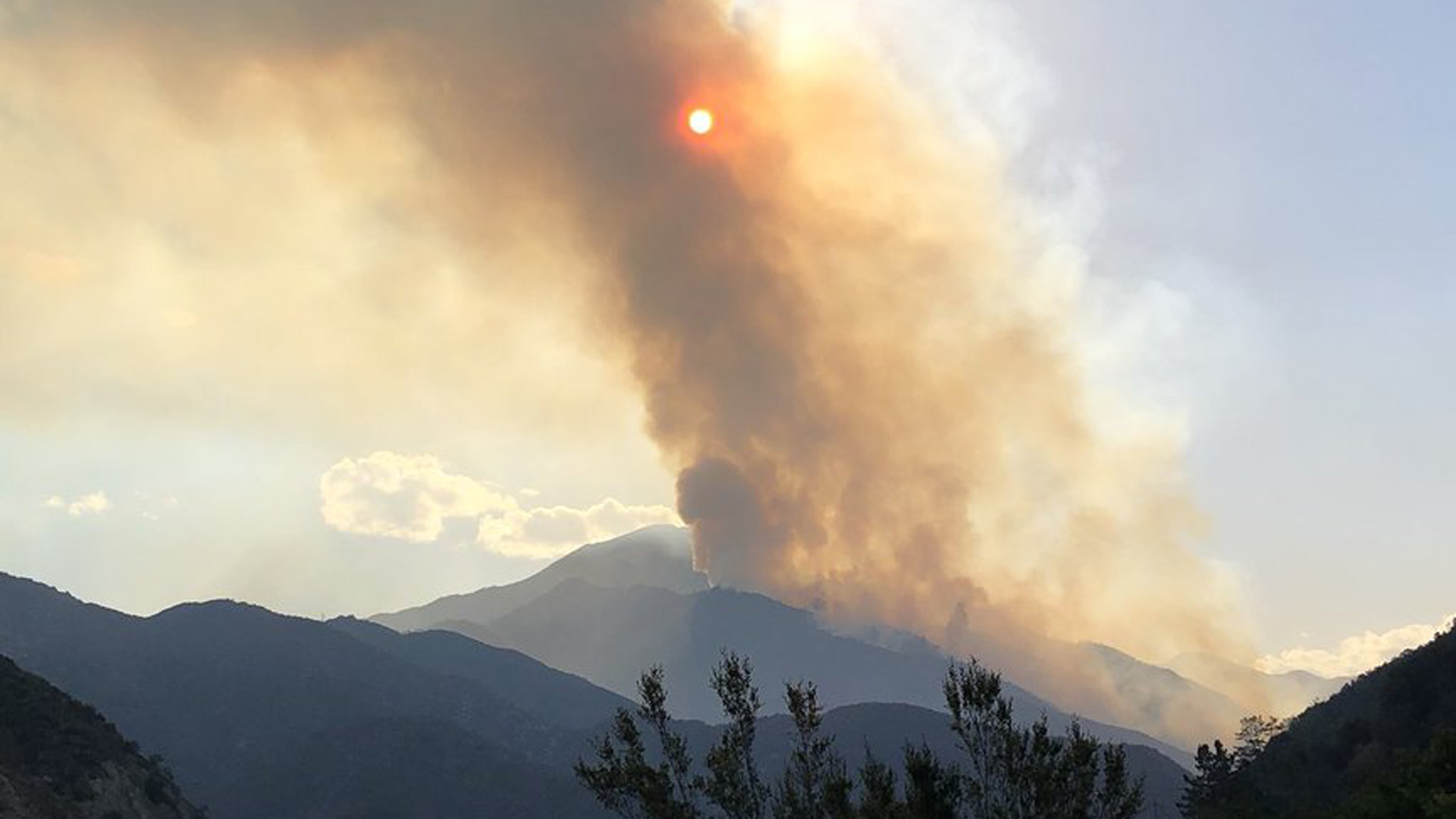 An image tweeted by Cal Fire on July 8, 2018 shows smoke from the Valley Fire in the mountains east of San Bernardino.