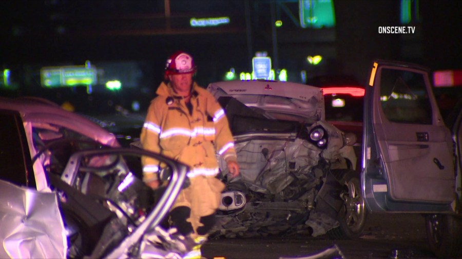 A firefighter at the scene of a multi-car crash in Irvine on Aug. 23, 2018. (Credit: OnScene.TV)