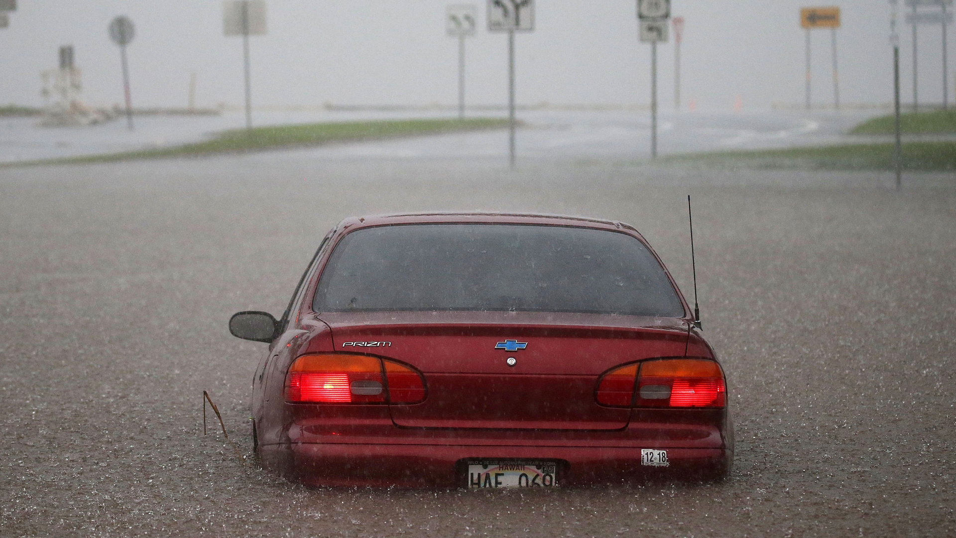 A car is seen partially submerged in water from Hurricane Lane rainfall on the Big Island of Hawaii on Thursday, Aug. 23, 2018. (Credit: Getty Images)