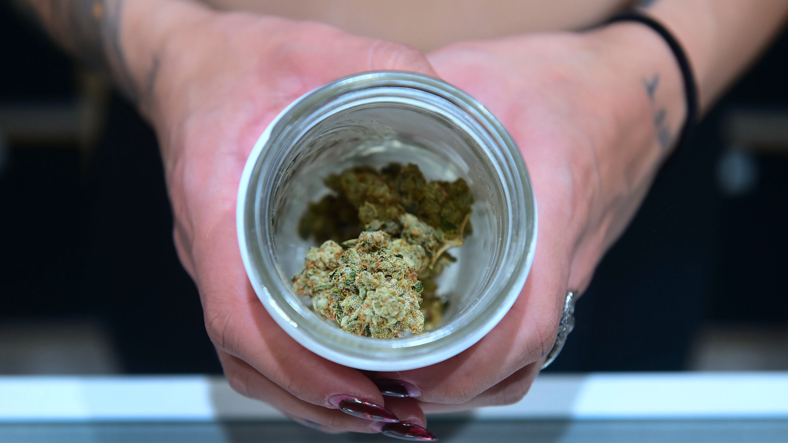 A jar of Insane OG, a strain of marijuana, is displayed at the opening of Dr. Greenthumb, the flagship medical and recreational marijuana dispensary opened by B Real of Cypress Hill fame in Sylmar, on Aug. 15, 2018. (Credit: Frederic J. Brown / AFP / Getty Images)