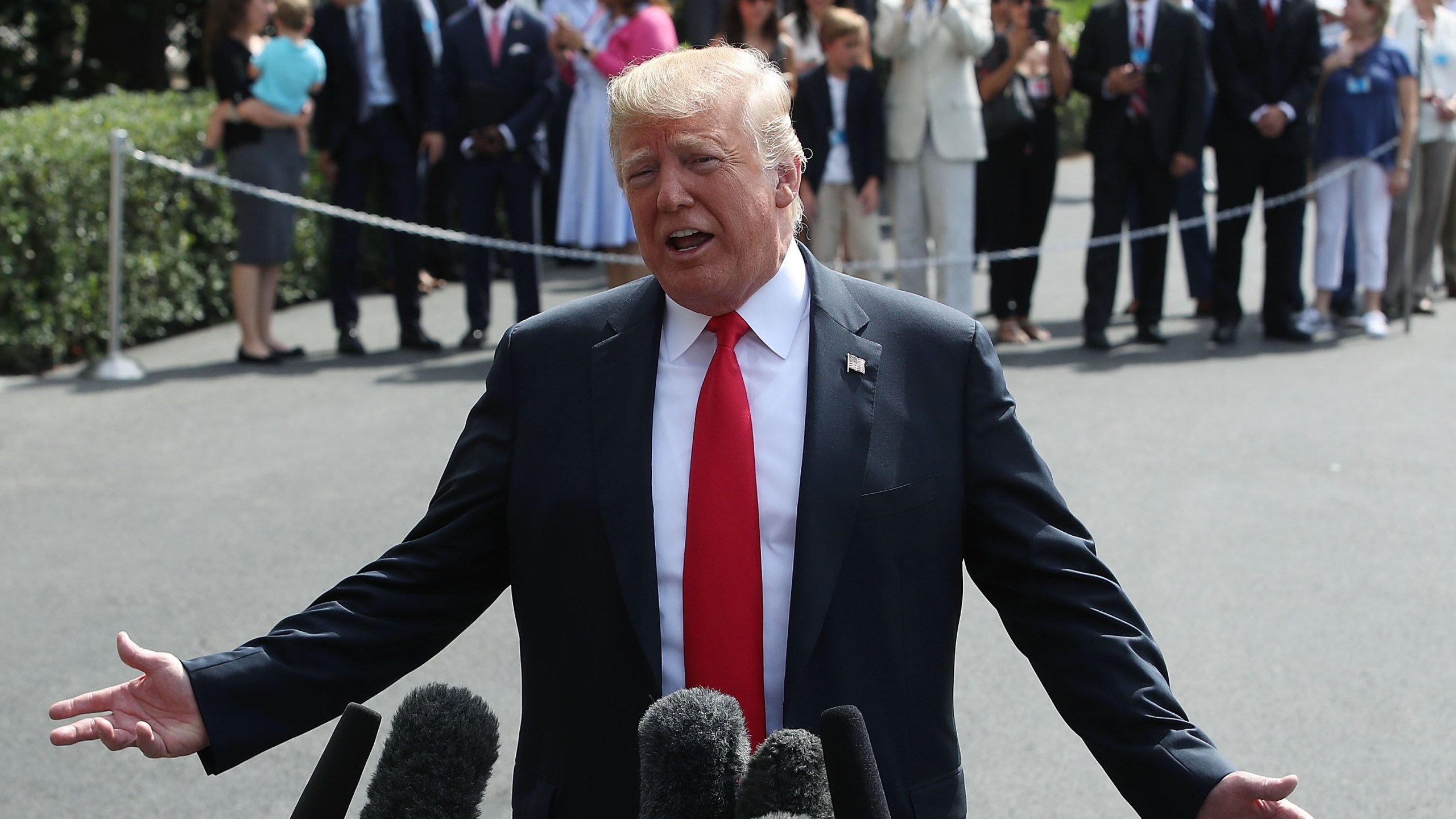 Donald Trump speaks to the media at the White House before departing on Marine One to New York on Aug. 17, 2018. (Credit: Mark Wilson/Getty Images)